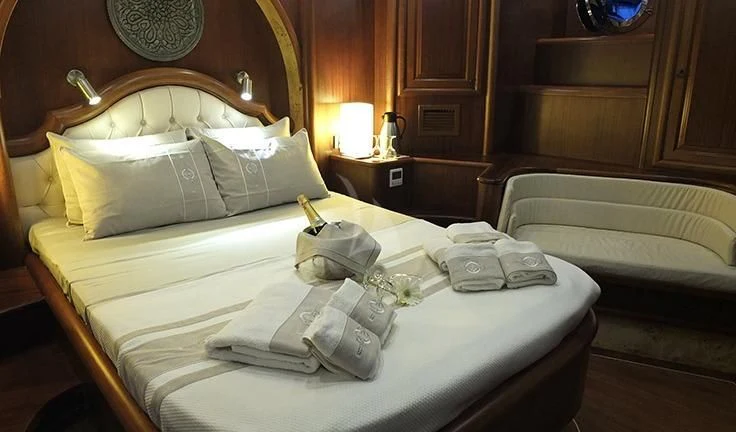 a hotel room with a bed aboard KAPTAN MEHMET BUGRA Yacht for Sale