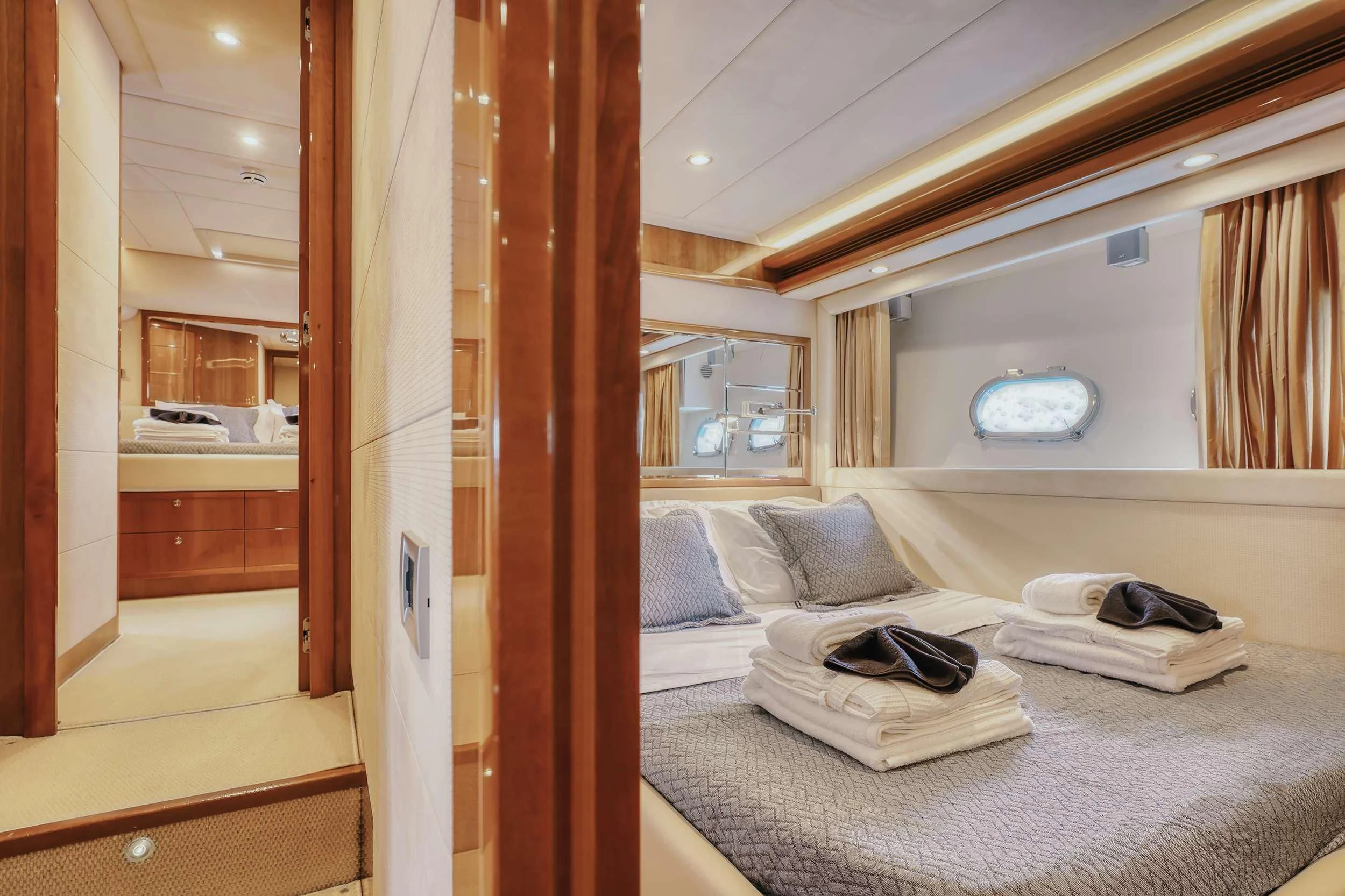a bedroom with a bed and a closet aboard LIDIA Yacht for Sale