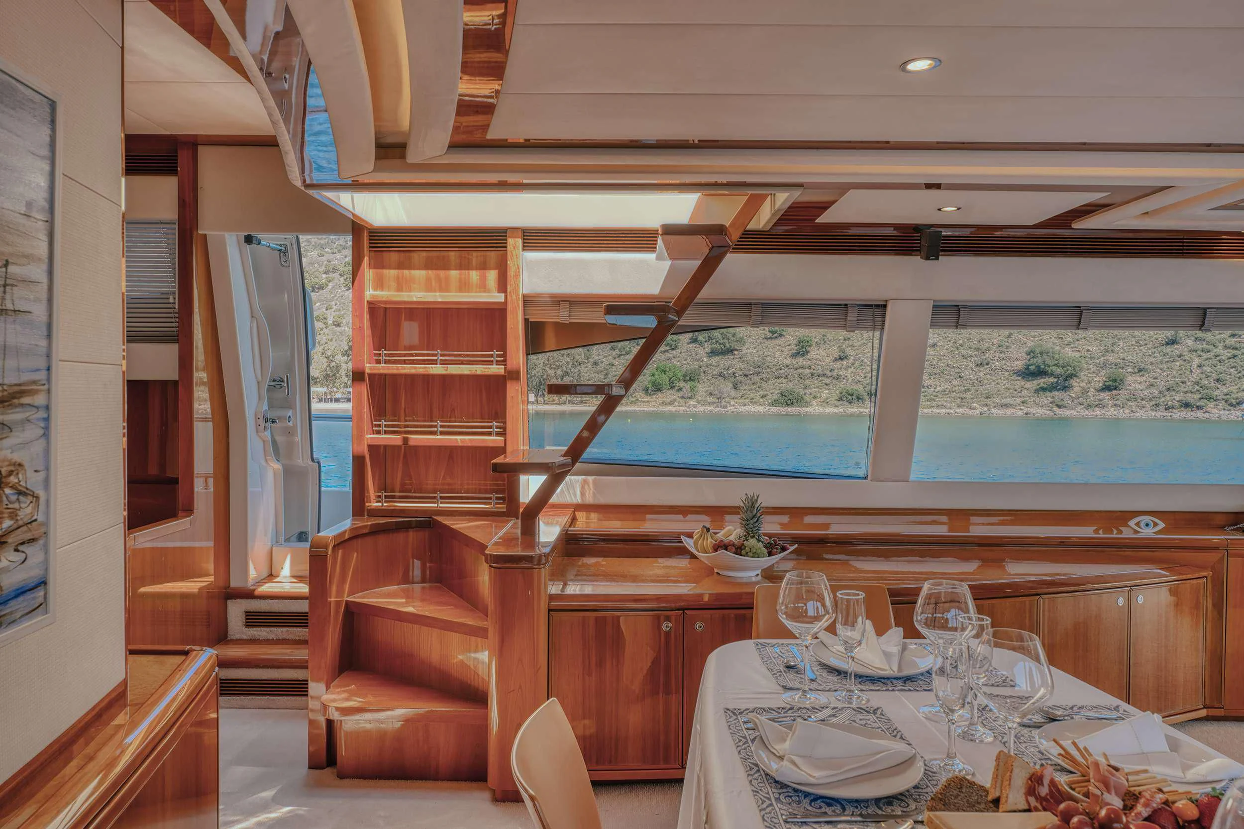 a dining table in a room aboard LIDIA Yacht for Sale