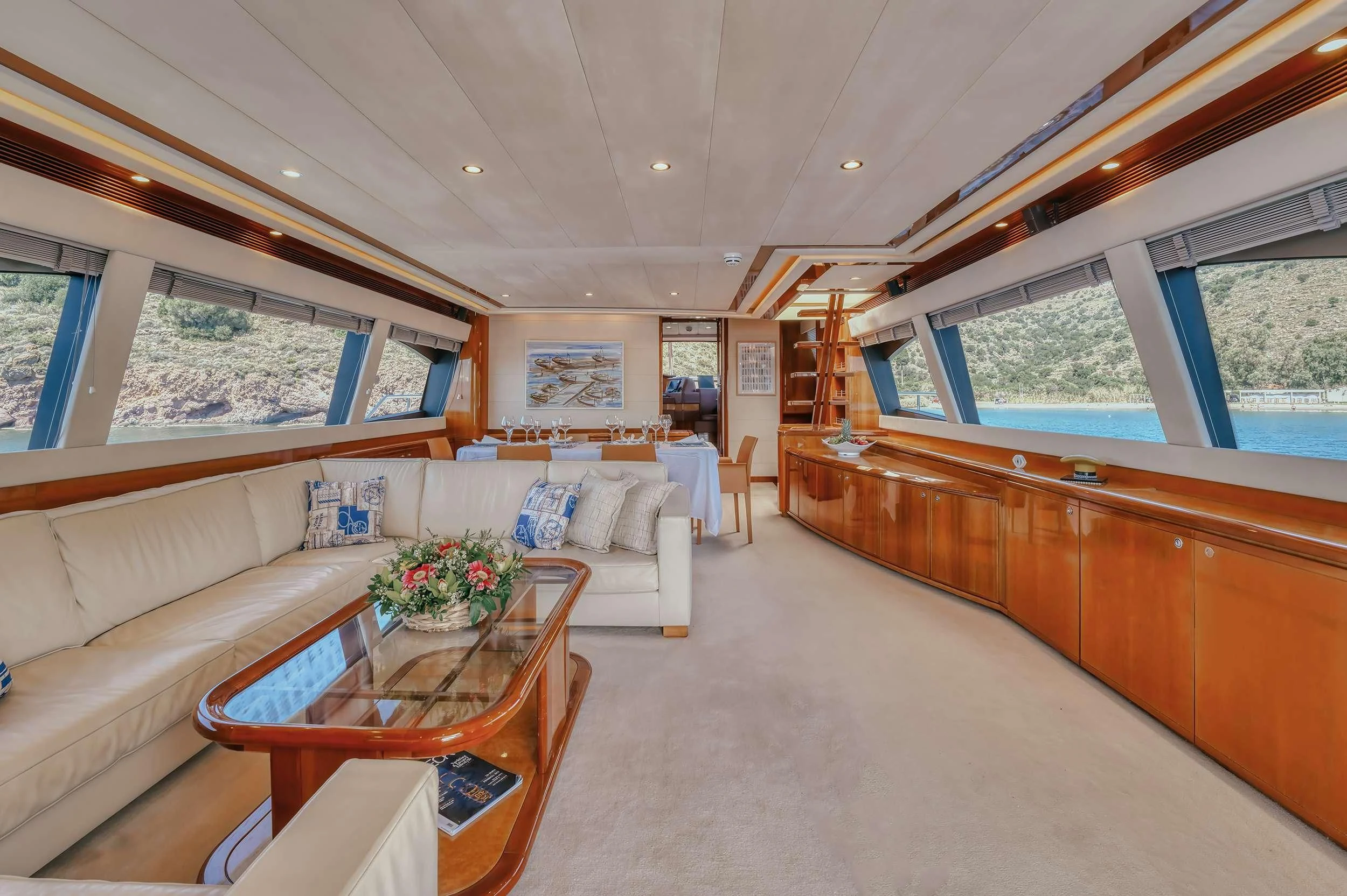 a living room with a couch and a table aboard LIDIA Yacht for Sale