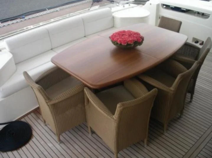 a table and chairs on a deck aboard LIDIA Yacht for Sale