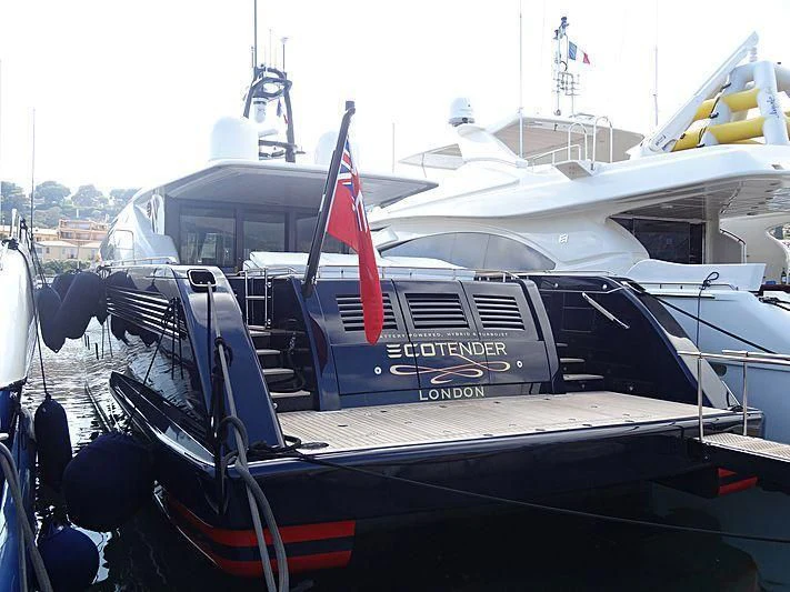 a boat with a flag on the deck aboard BLUE ROSE Yacht for Sale