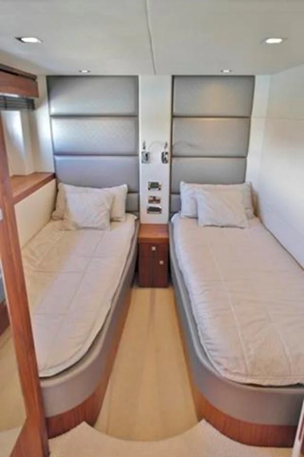 a room with a couple of beds aboard SUNSEEKER MANHATTAN 63 Yacht for Sale