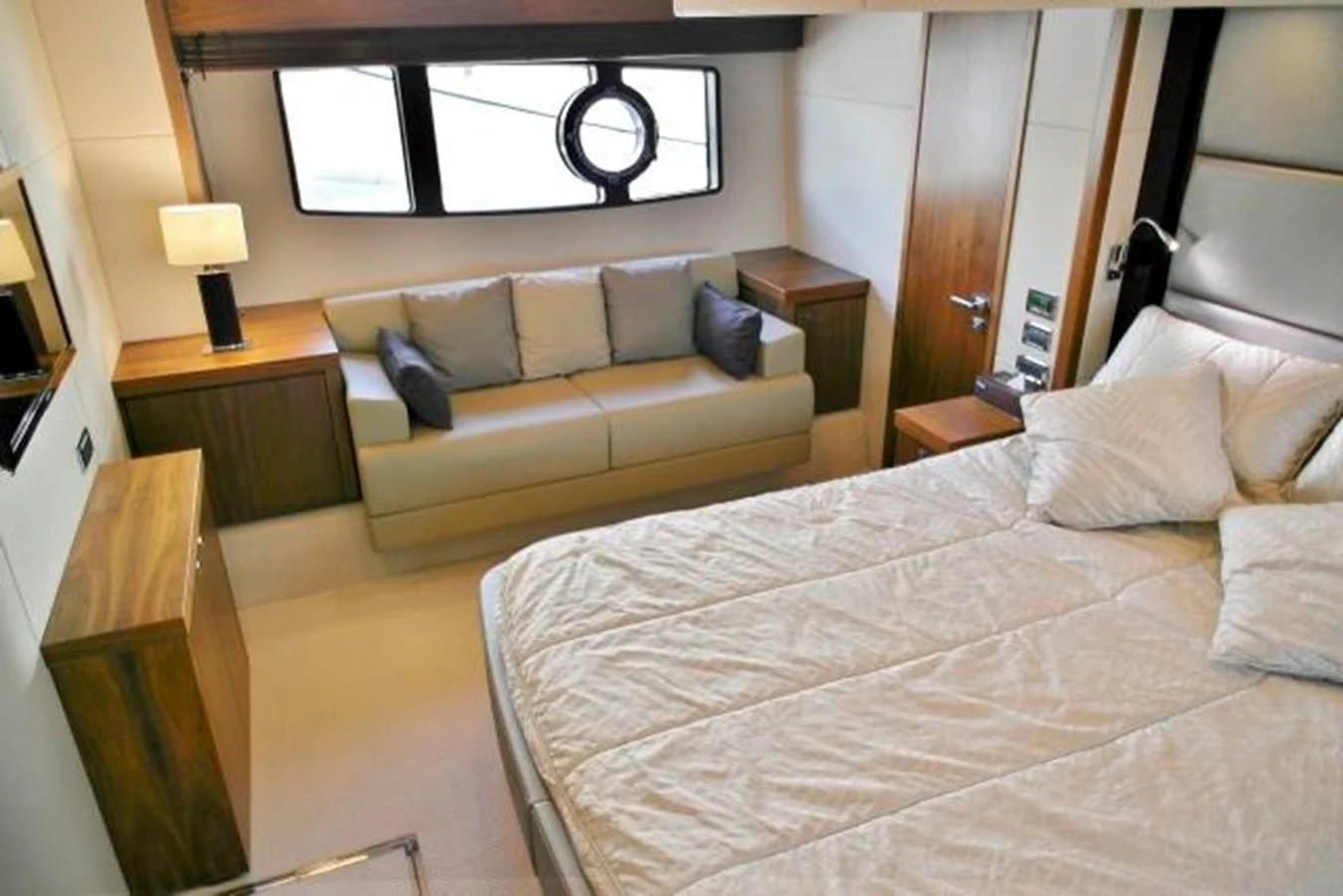 a hotel room with a bed and a couch aboard SUNSEEKER MANHATTAN 63 Yacht for Sale