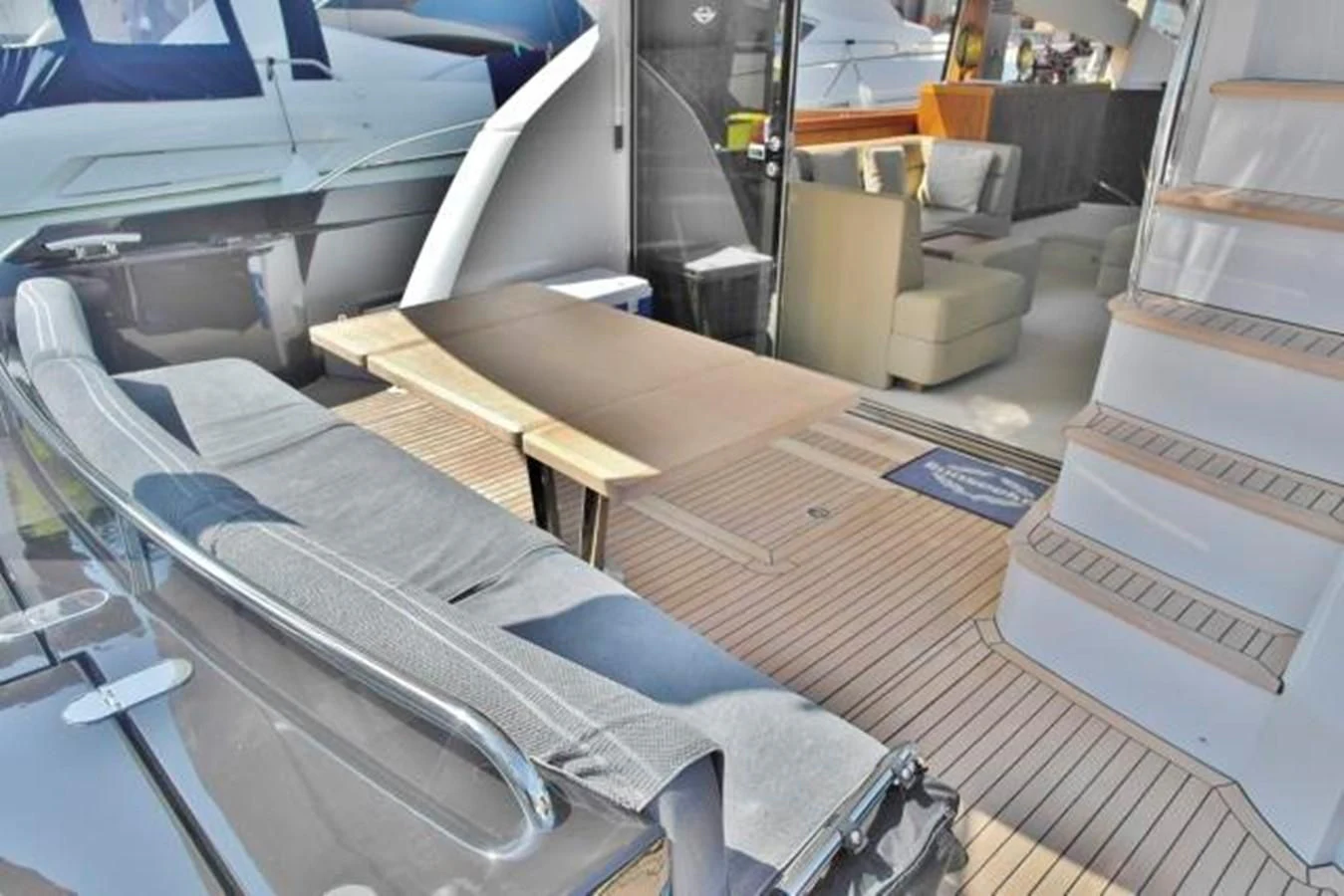 a room with a bed and desk aboard SUNSEEKER MANHATTAN 63 Yacht for Sale