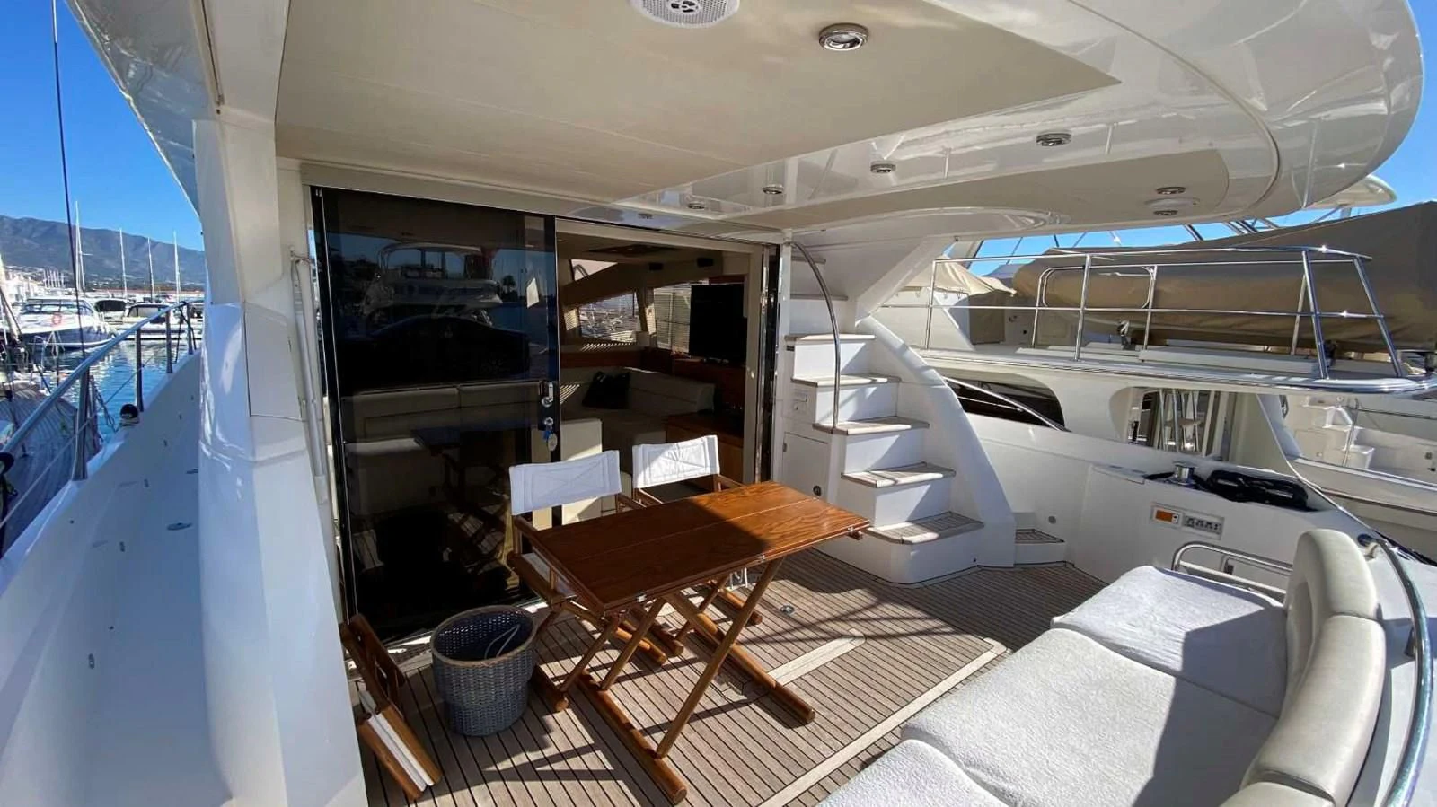 a boat with a desk and a chair on the deck aboard SUNSEEKER MANHATTAN 63 Yacht for Sale
