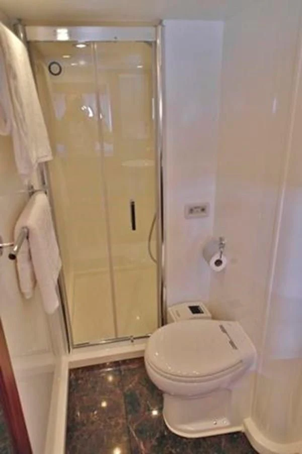 a bathroom with a shower and toilet aboard SUNSEEKER MANHATTAN 63 Yacht for Sale