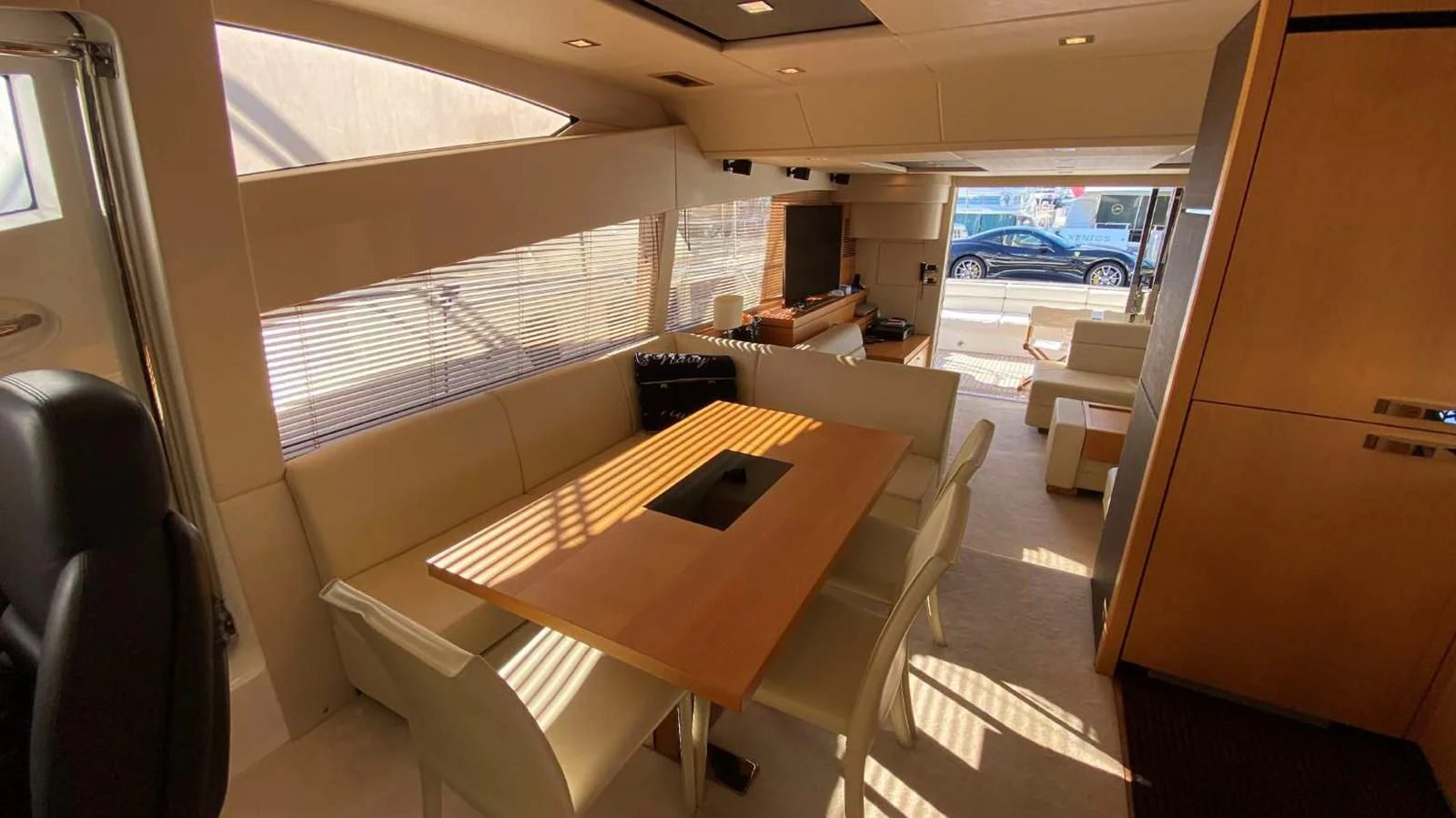 a room with a table and chairs aboard SUNSEEKER MANHATTAN 63 Yacht for Sale