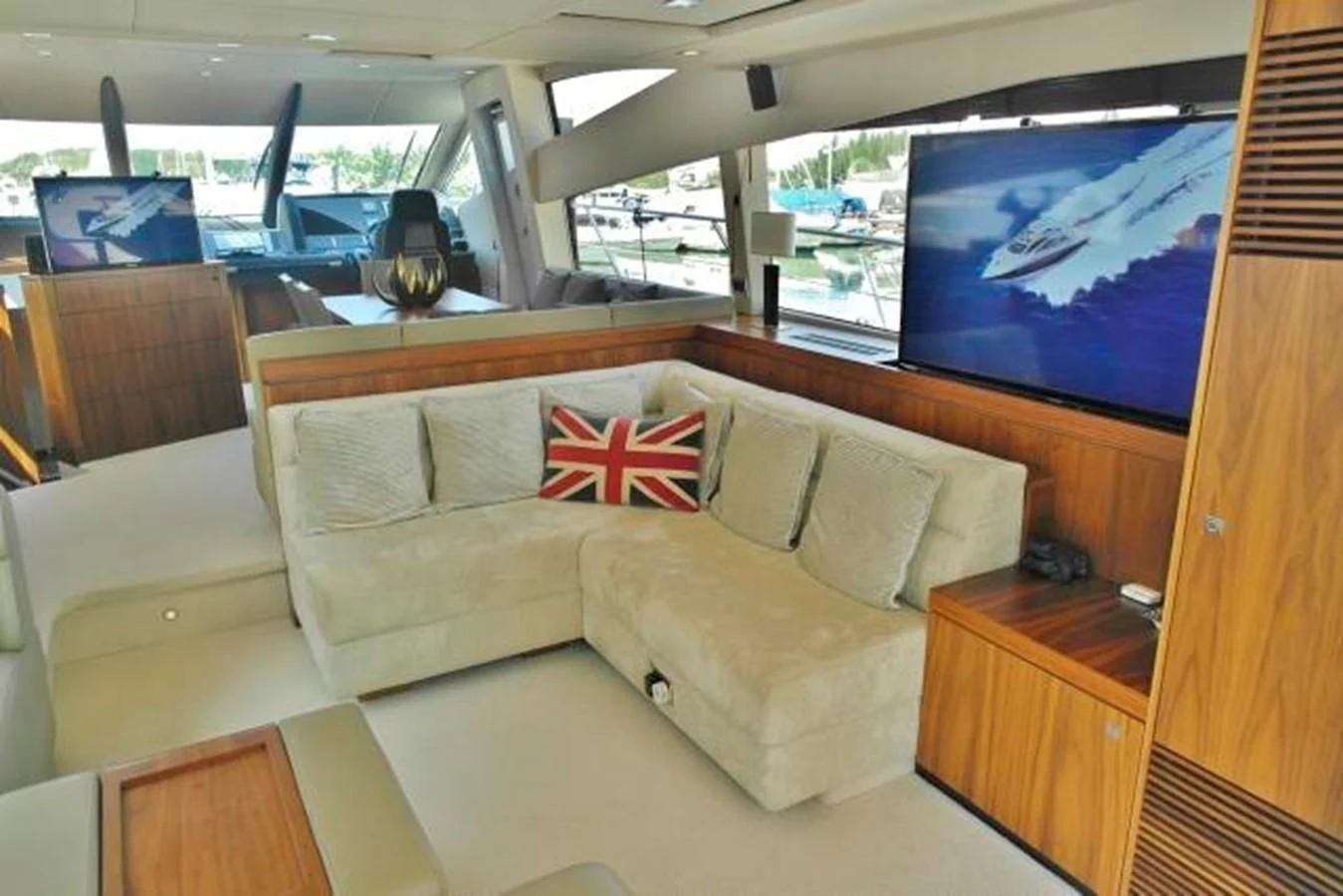 a living room with a couch and a tv aboard SUNSEEKER MANHATTAN 63 Yacht for Sale