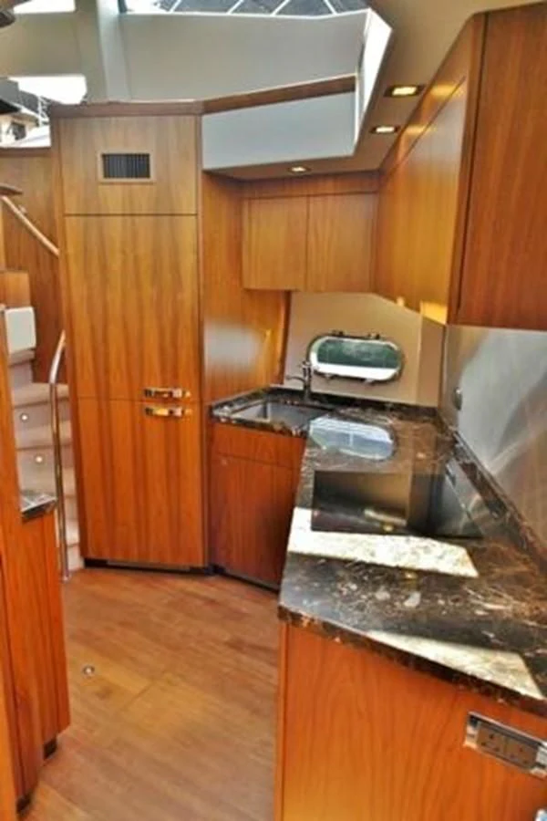 a kitchen with a stove and cabinets aboard SUNSEEKER MANHATTAN 63 Yacht for Sale