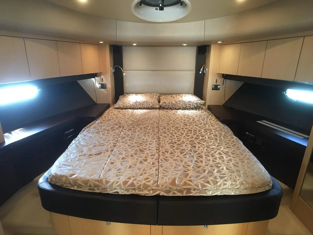 a bed in a room aboard SUNSEEKER MANHATTAN 63 Yacht for Sale