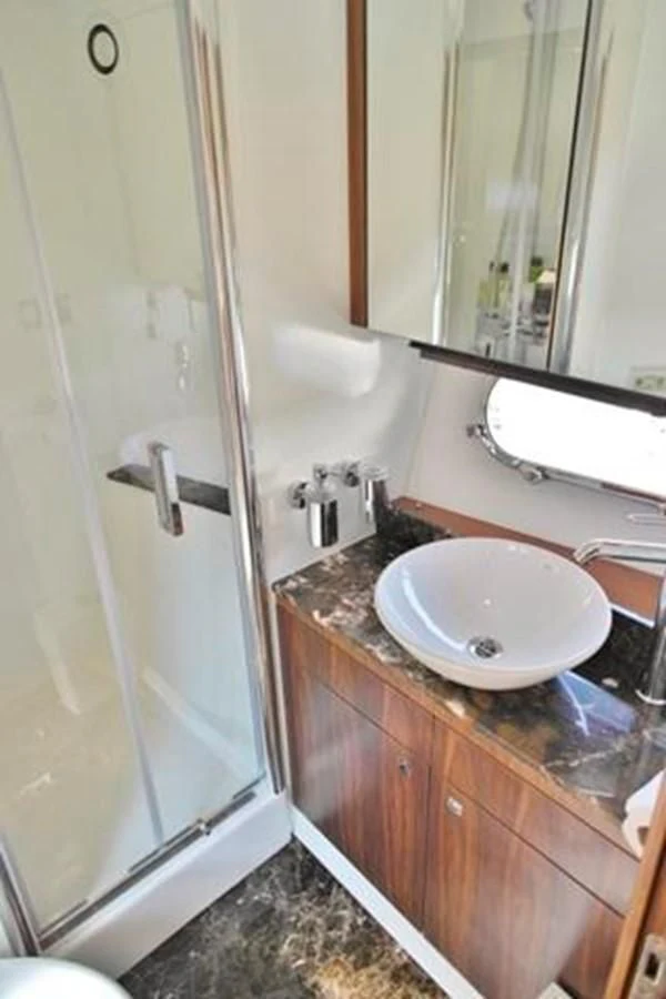 a bathroom with a sink and a shower aboard SUNSEEKER MANHATTAN 63 Yacht for Sale