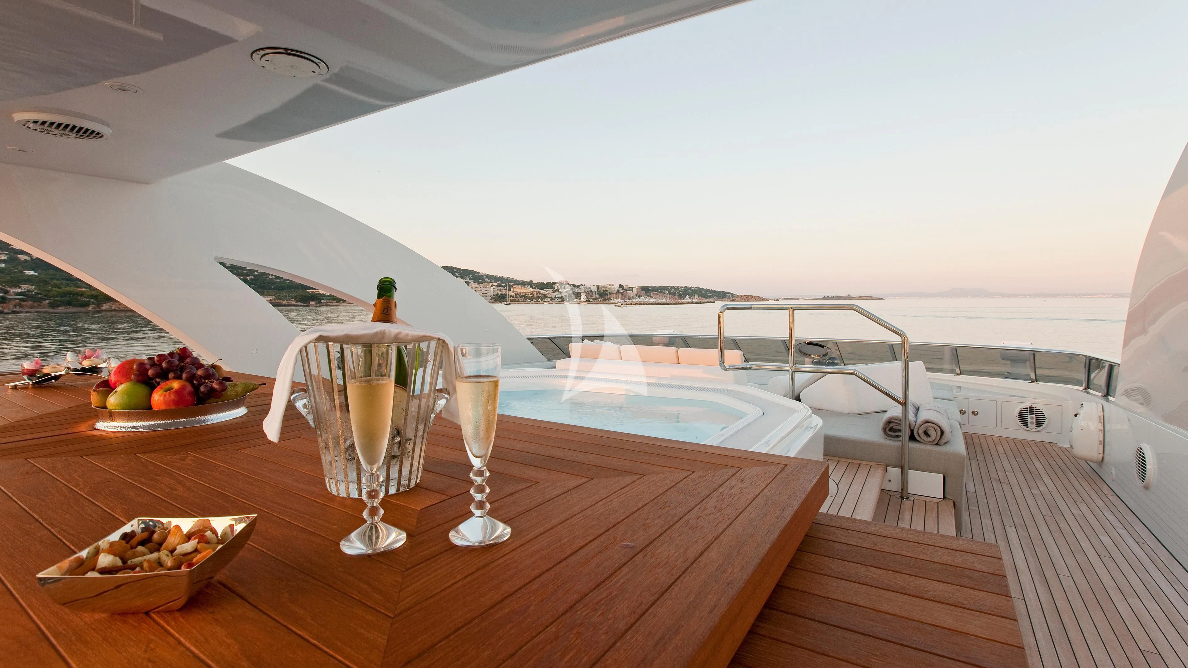 a table with glasses and food on it aboard JEMS Yacht for Sale