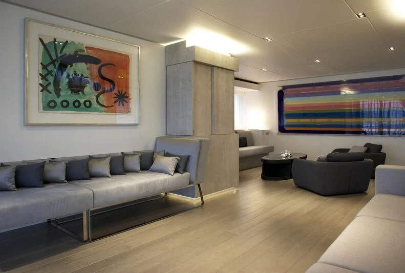 a living room with a large screen aboard JEMS Yacht for Sale