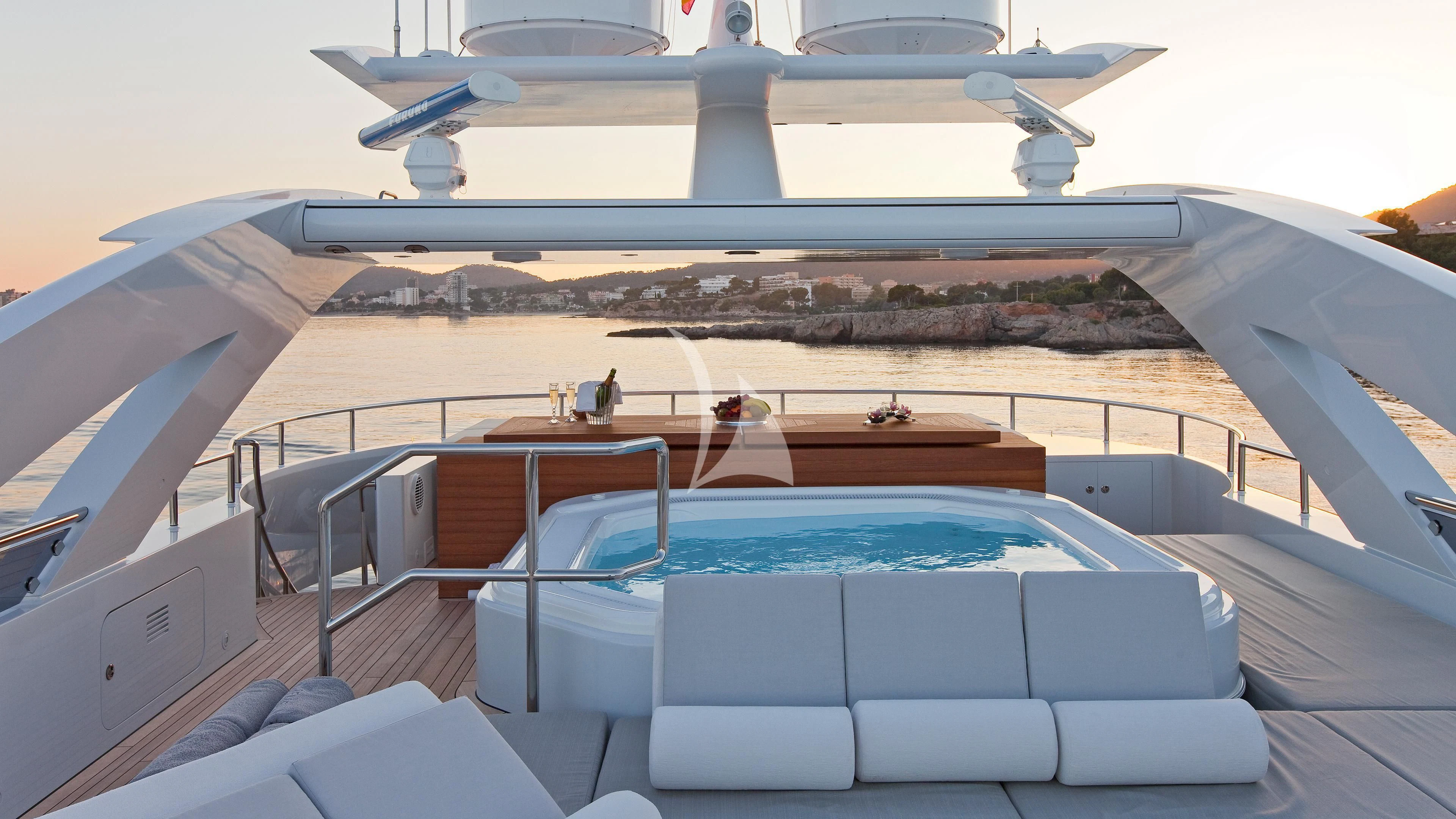 a large pool with a view of the land below aboard JEMS Yacht for Sale