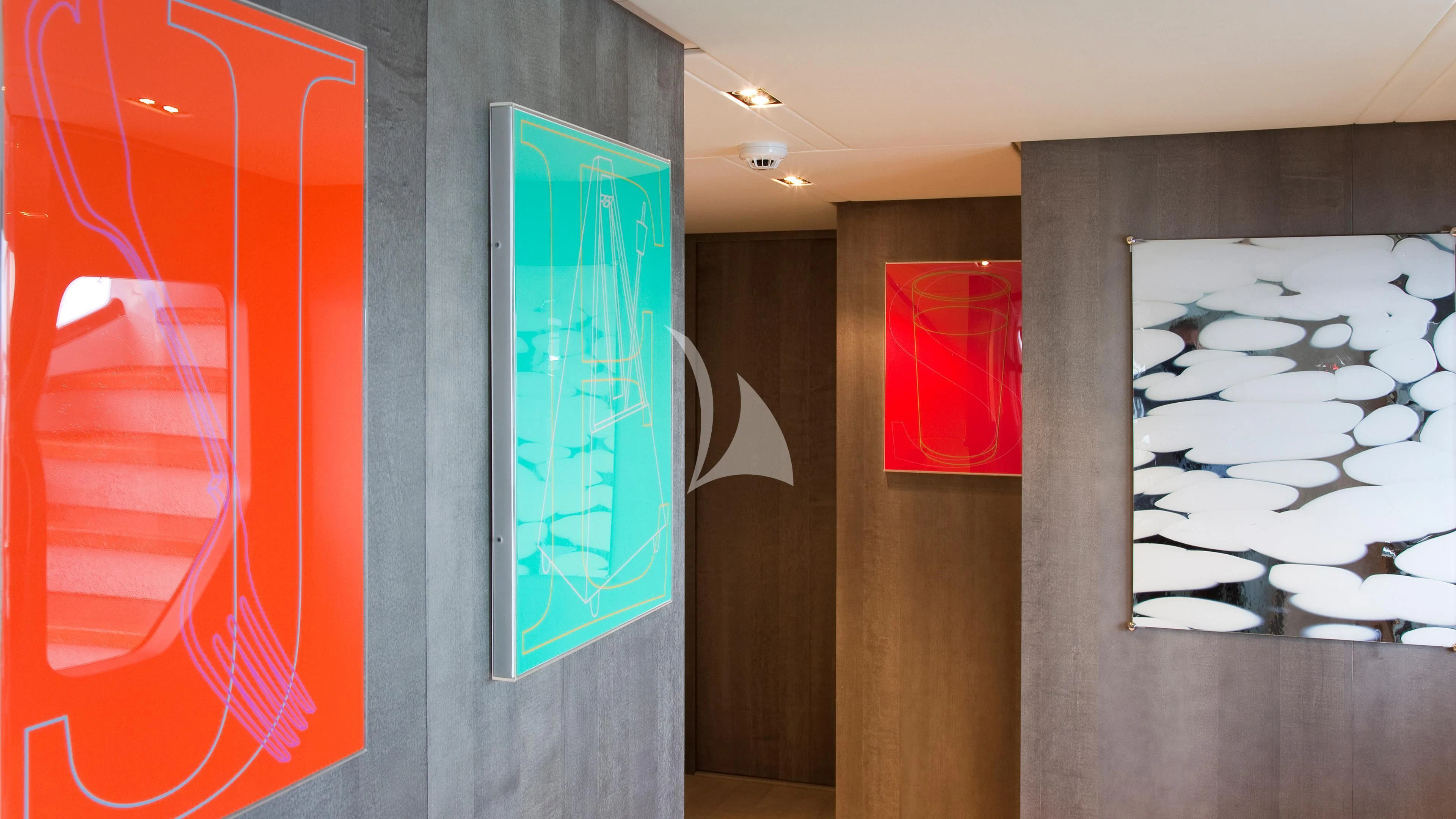 a room with a painting on the wall aboard JEMS Yacht for Sale