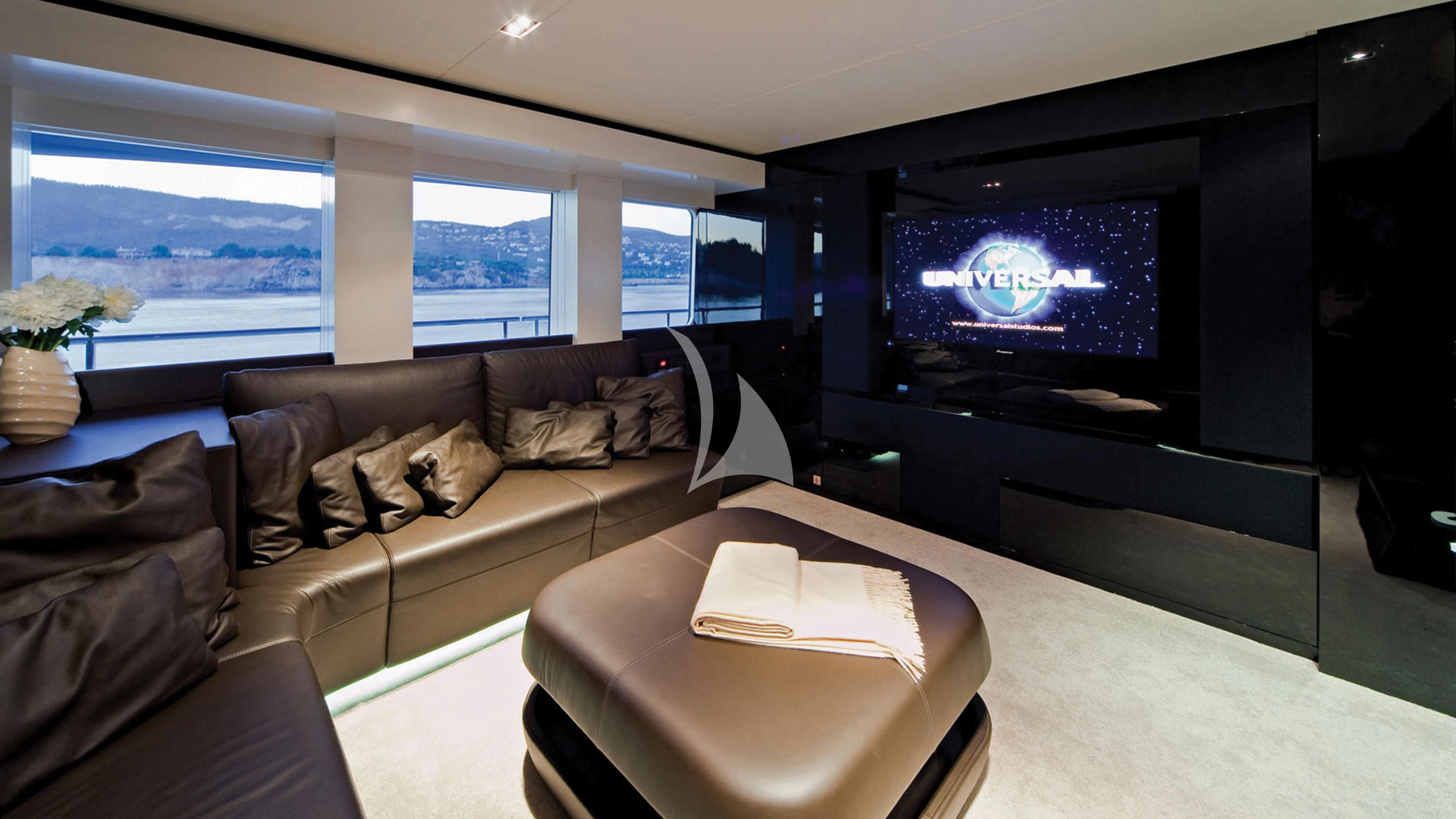 a dog lying on a couch in a living room aboard JEMS Yacht for Sale