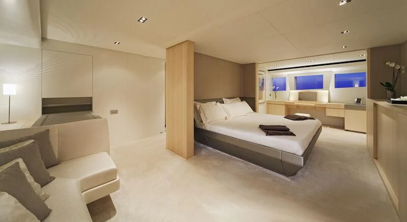 a room with a bed and a couch aboard JEMS Yacht for Sale