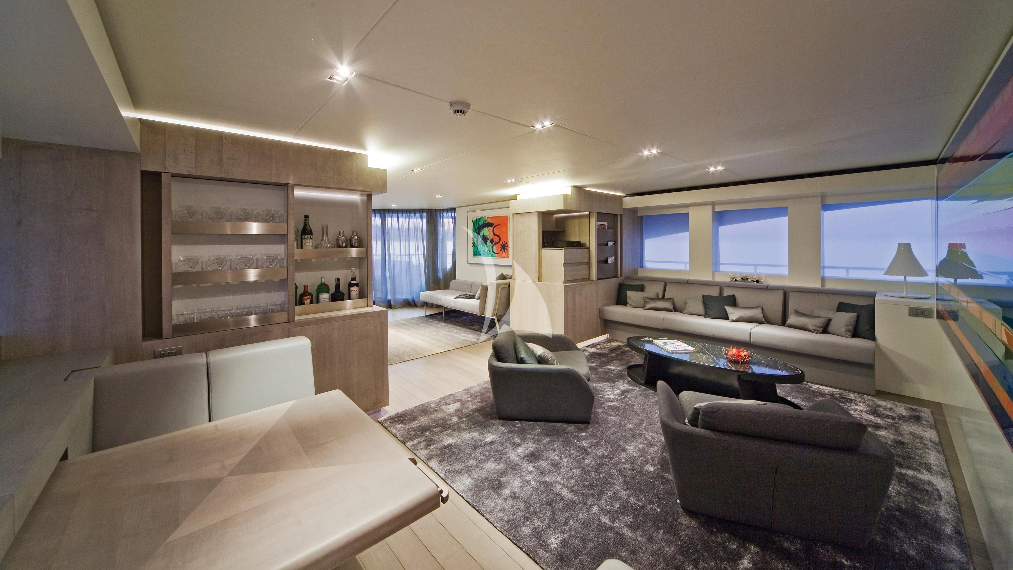 a living room with a large screen aboard JEMS Yacht for Sale