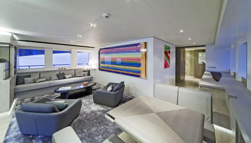 a room with couches and a television aboard JEMS Yacht for Sale