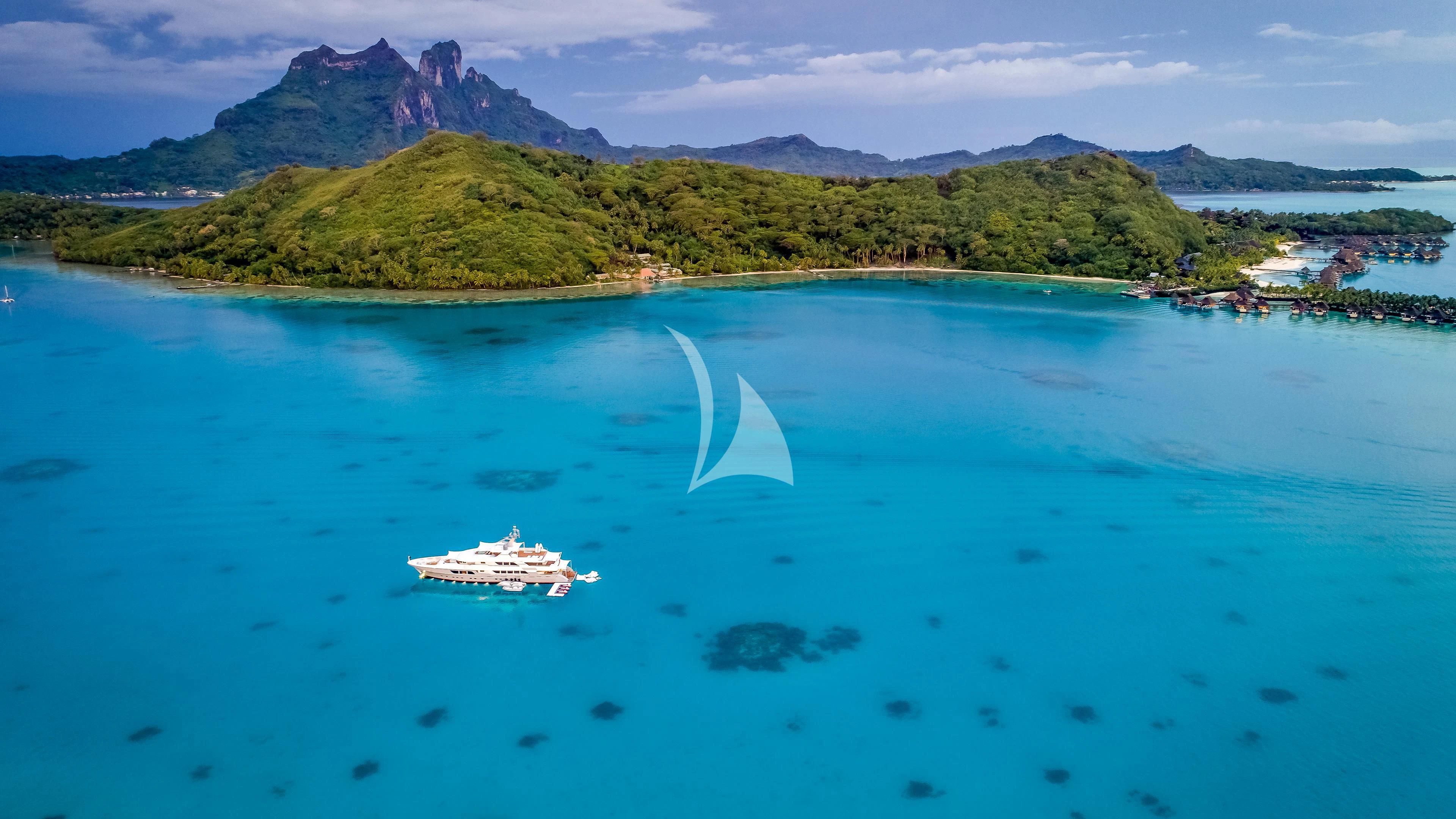 a body of water with a boat in it and a waterfall in the background aboard ENDLESS SUMMER Yacht for Sale