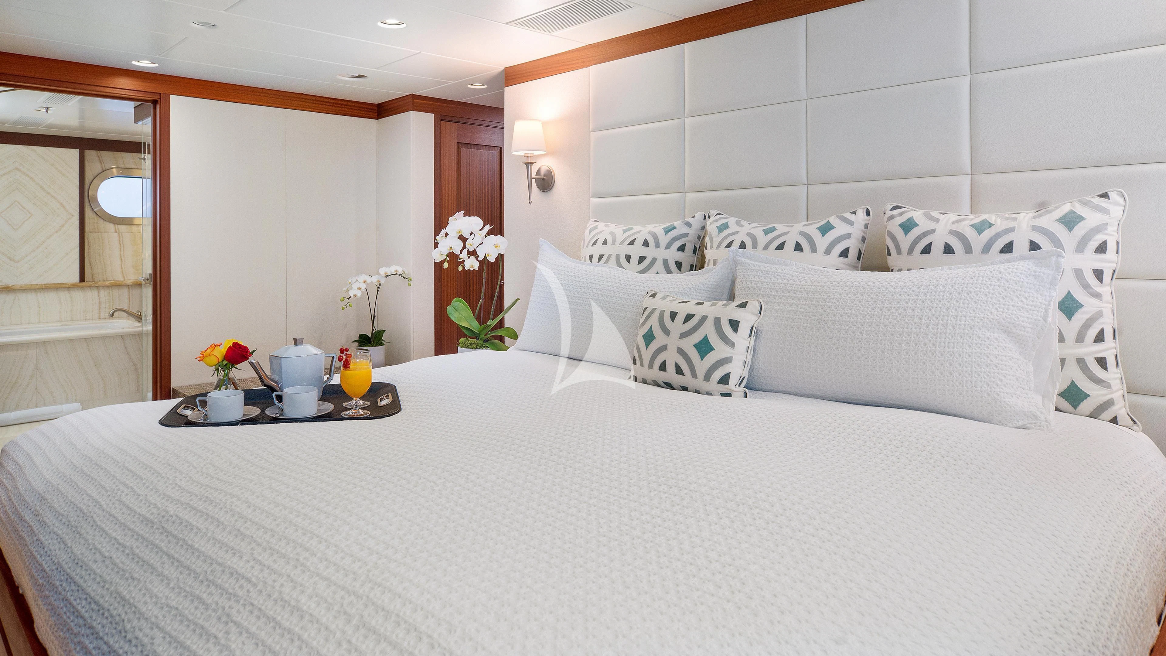 a bed with white sheets and pillows aboard ENDLESS SUMMER Yacht for Sale