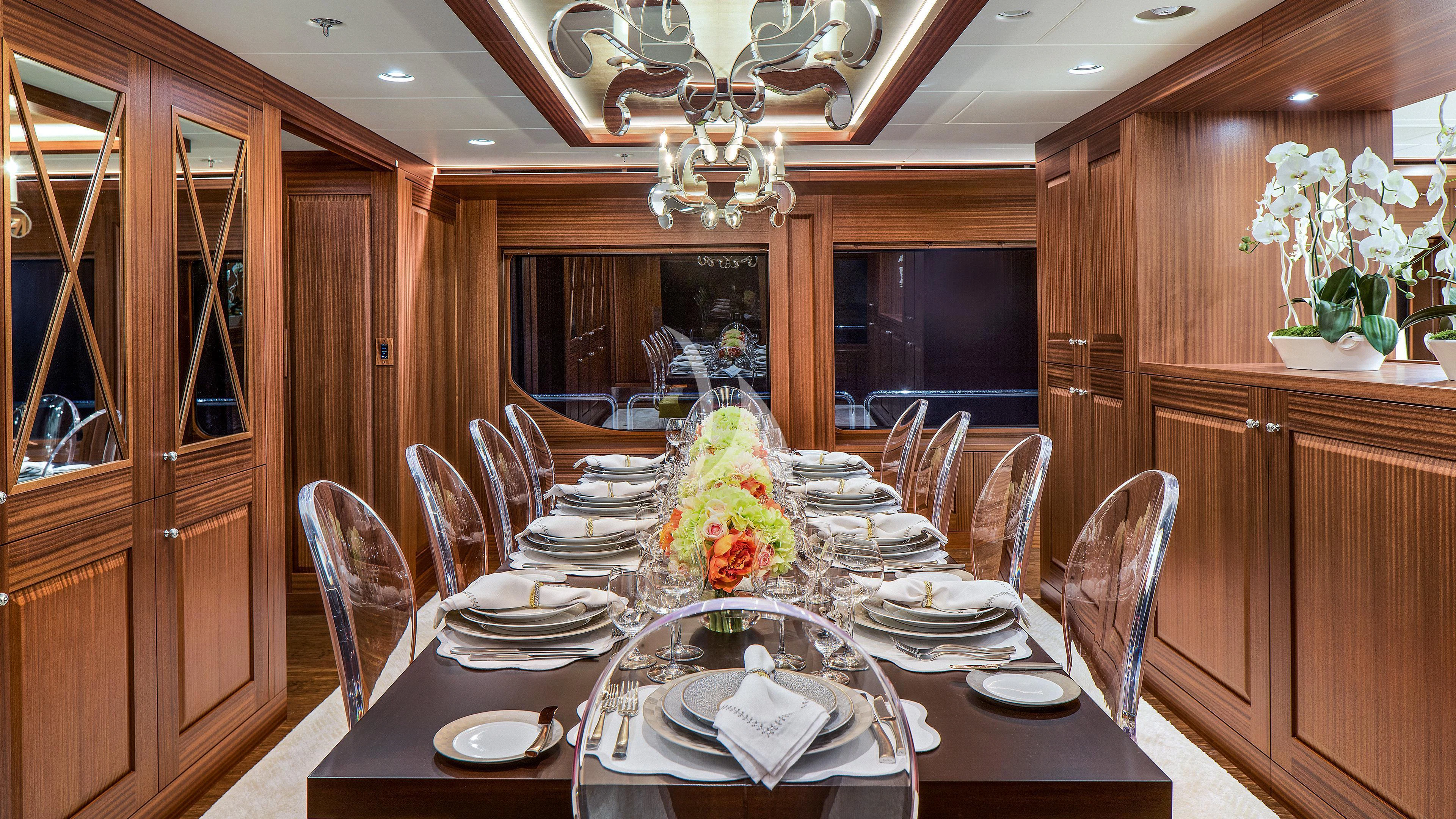 a dining room with a table set aboard ENDLESS SUMMER Yacht for Sale