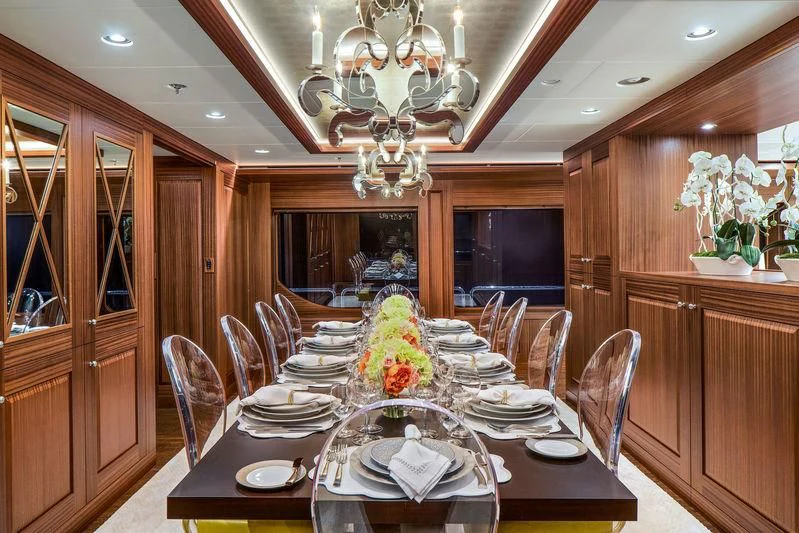 a dining room with a table set aboard ENDLESS SUMMER Yacht for Sale
