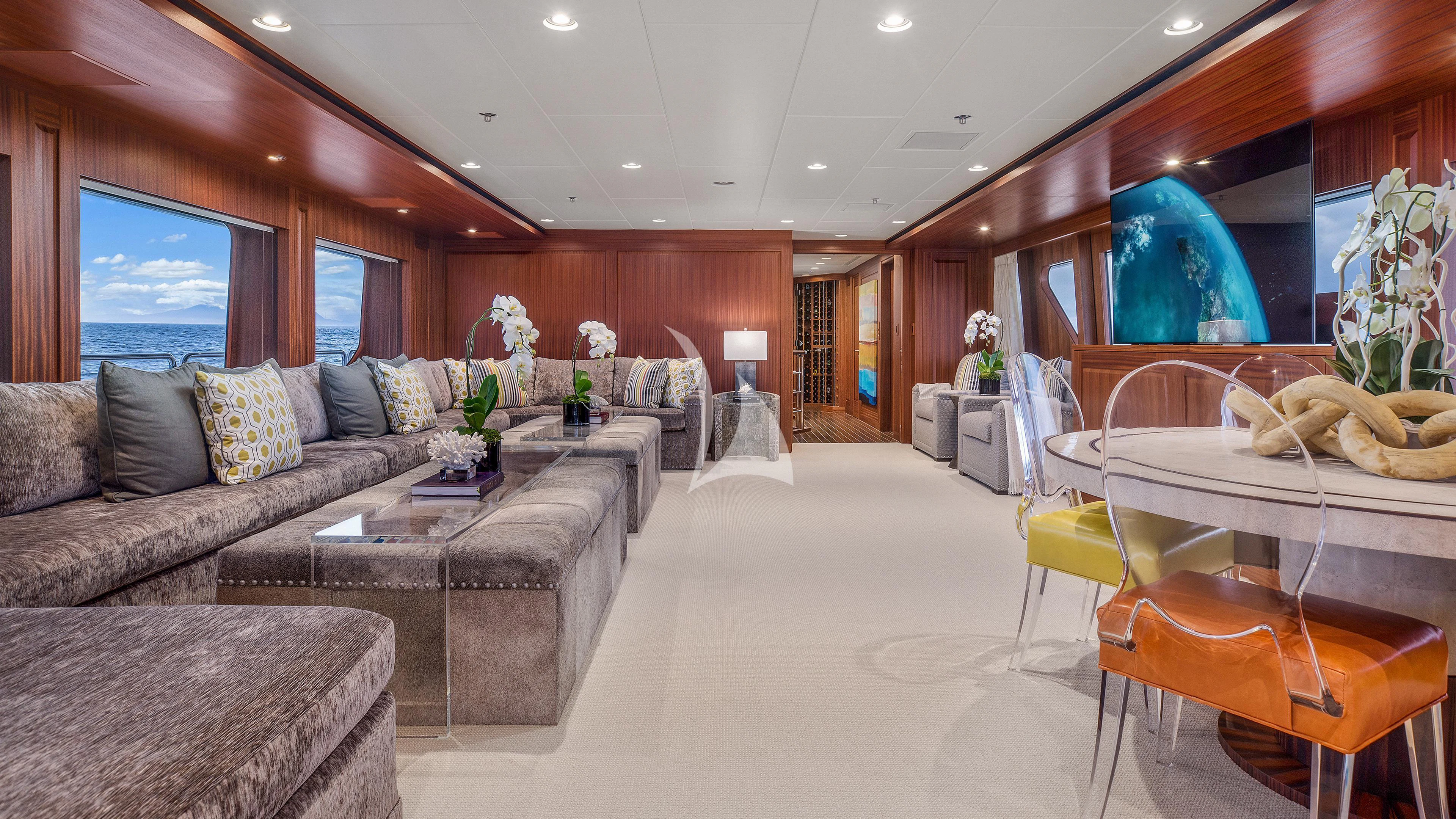 a living room with a couch and a table aboard ENDLESS SUMMER Yacht for Sale