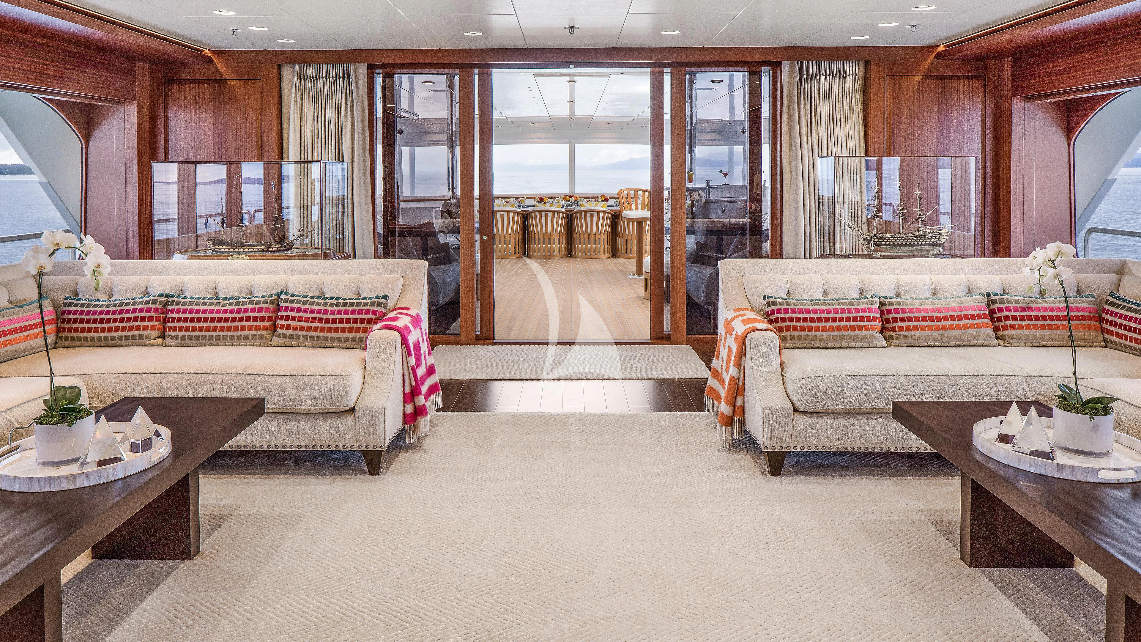 a living room with a couch and a table aboard ENDLESS SUMMER Yacht for Sale
