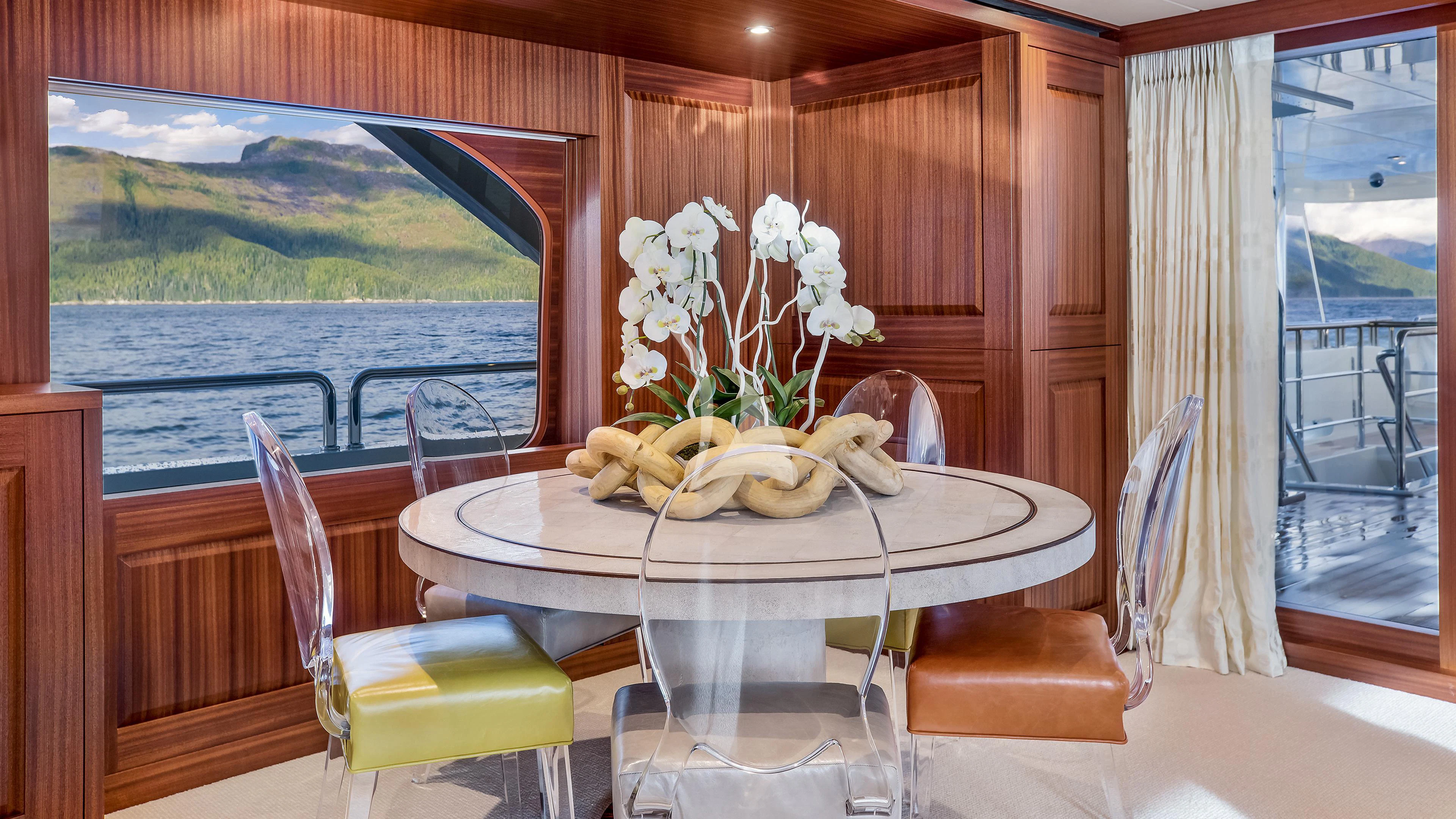 a table with flowers on it aboard ENDLESS SUMMER Yacht for Sale