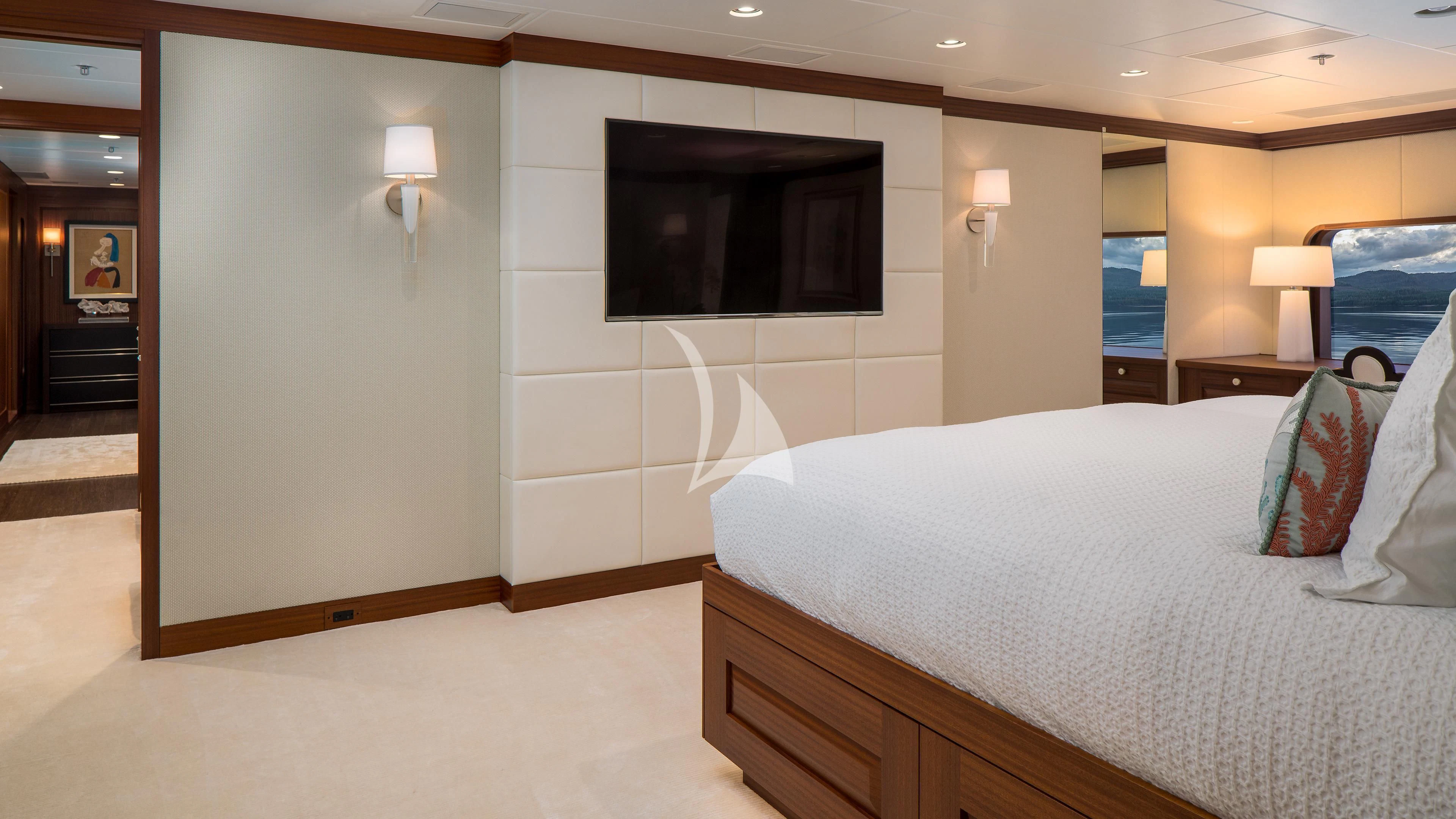 a hotel room with a bed and a tv aboard ENDLESS SUMMER Yacht for Sale