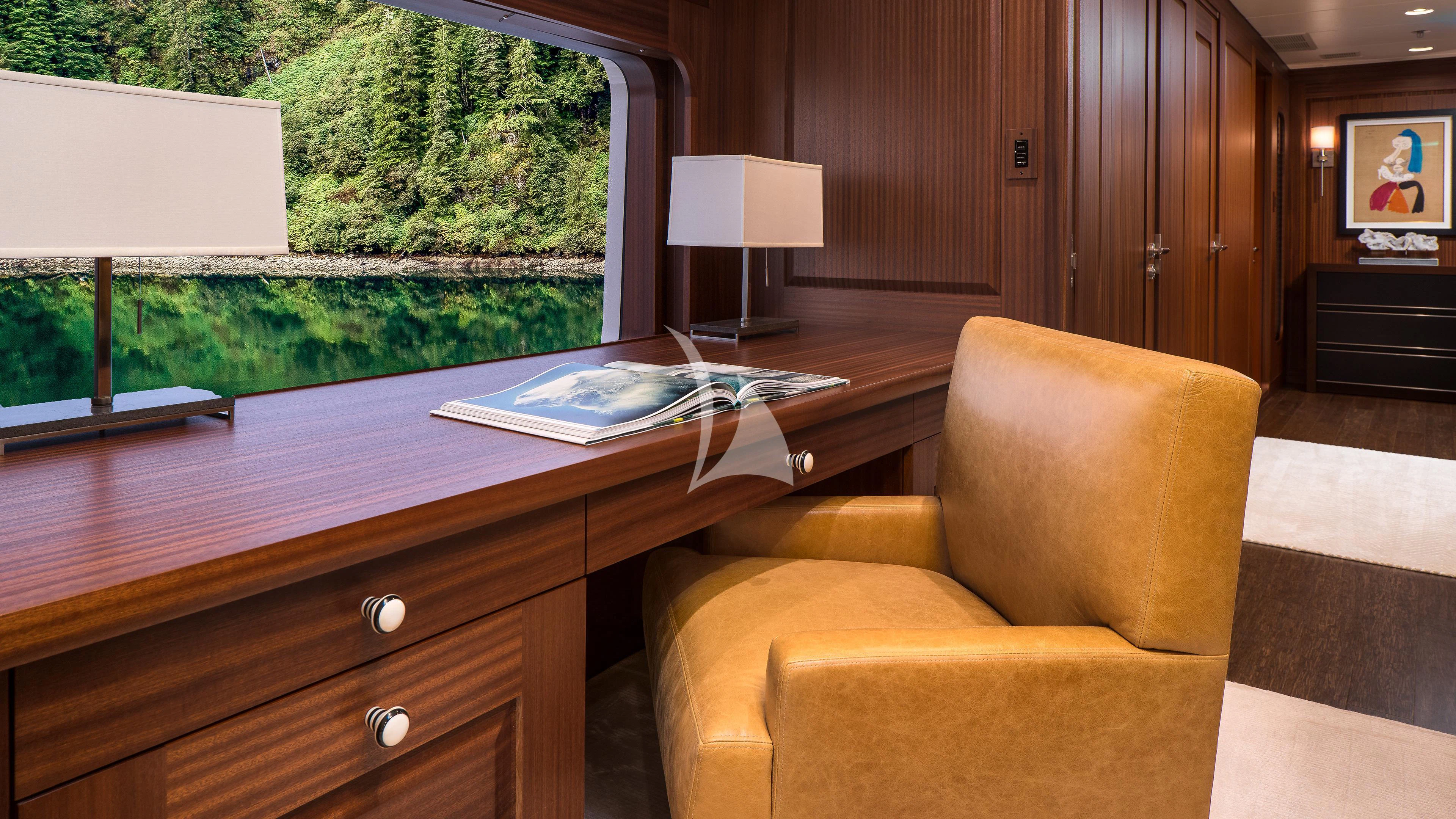 a room with a couch and a table and a lamp aboard ENDLESS SUMMER Yacht for Sale