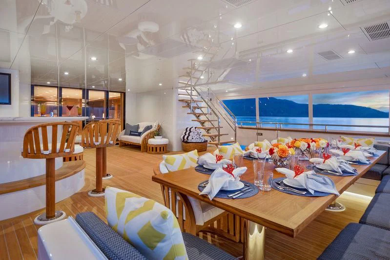 a room with a table and chairs aboard ENDLESS SUMMER Yacht for Sale