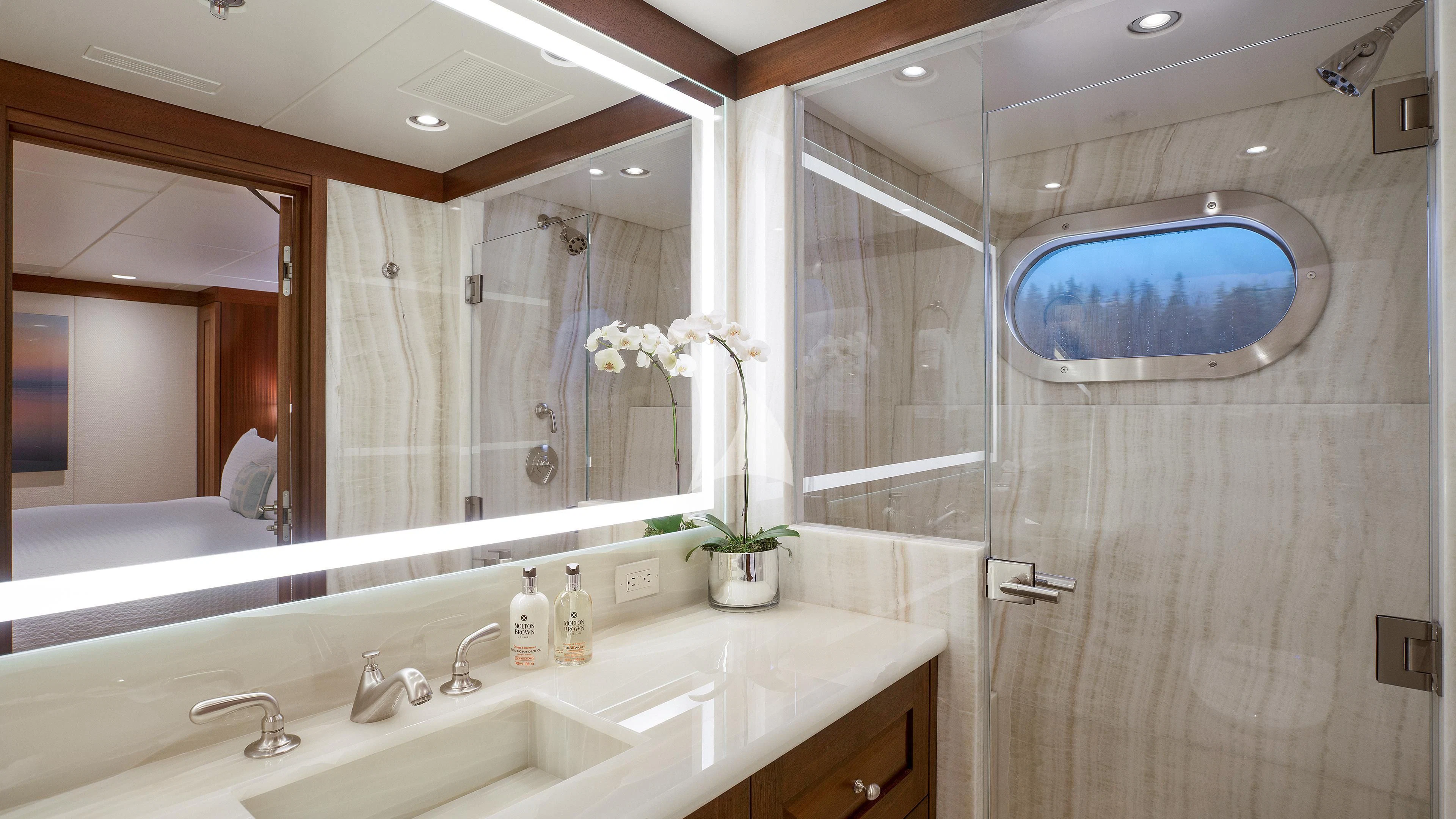 a bathroom with a large mirror aboard ENDLESS SUMMER Yacht for Sale