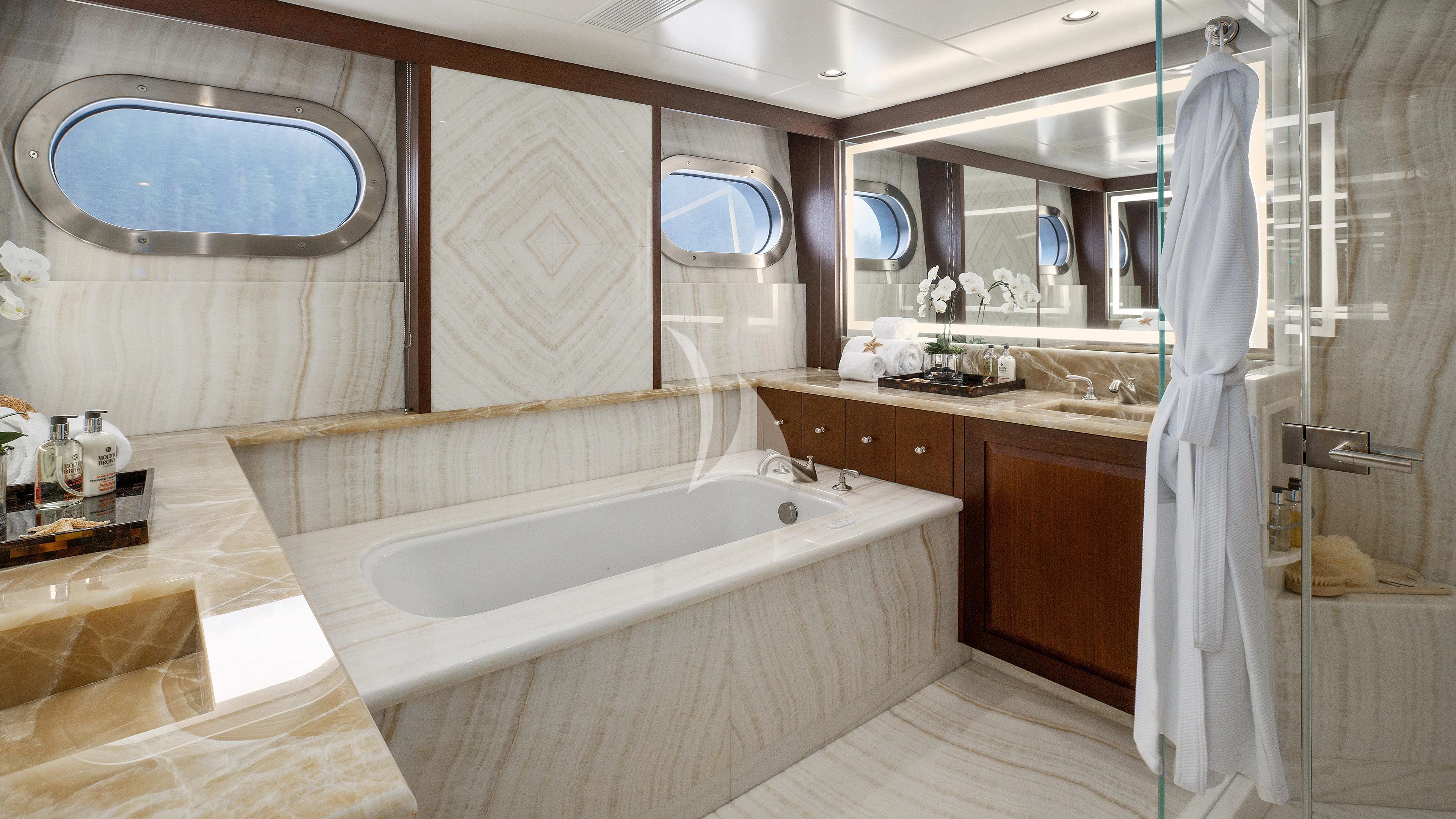 a bathroom with a bathtub and sink aboard ENDLESS SUMMER Yacht for Sale