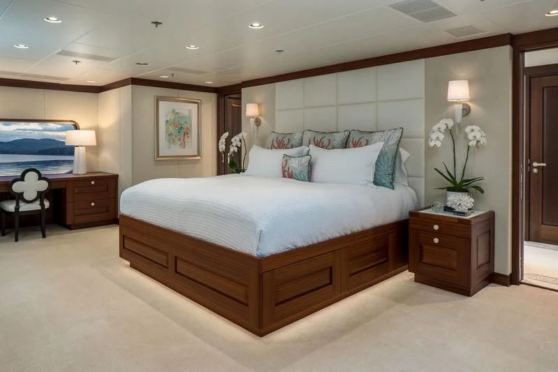 a bed with a white comforter aboard ENDLESS SUMMER Yacht for Sale
