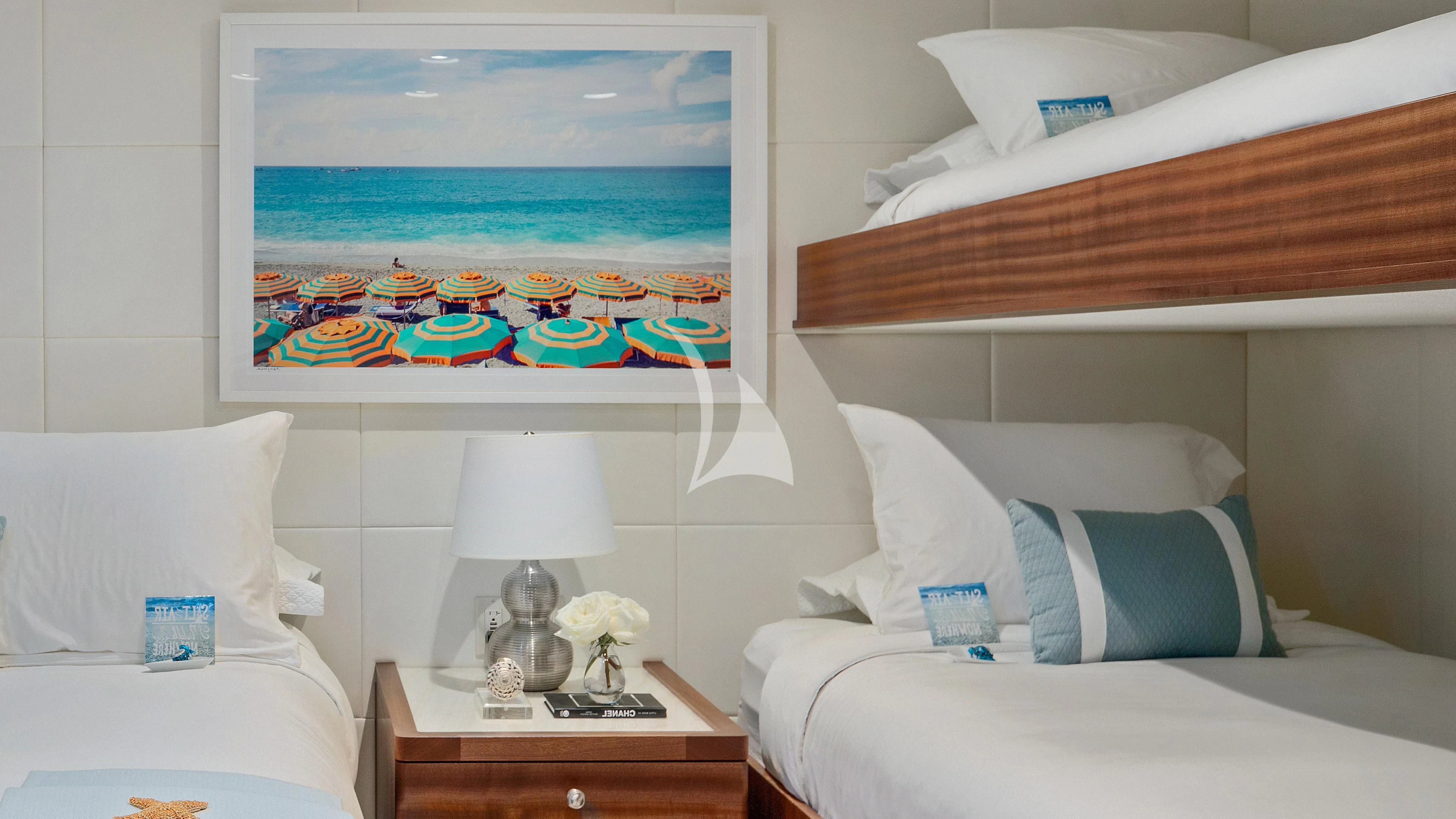 a room with a bed and a painting on the wall aboard ENDLESS SUMMER Yacht for Sale