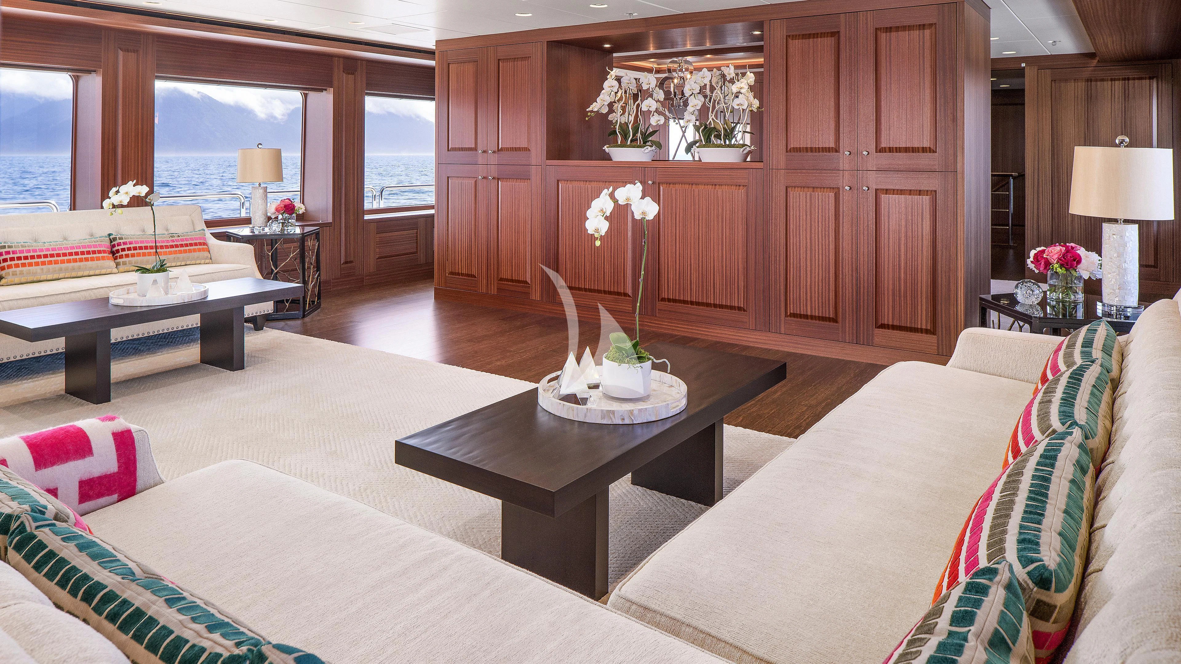 a living room with a couch and a coffee table aboard ENDLESS SUMMER Yacht for Sale