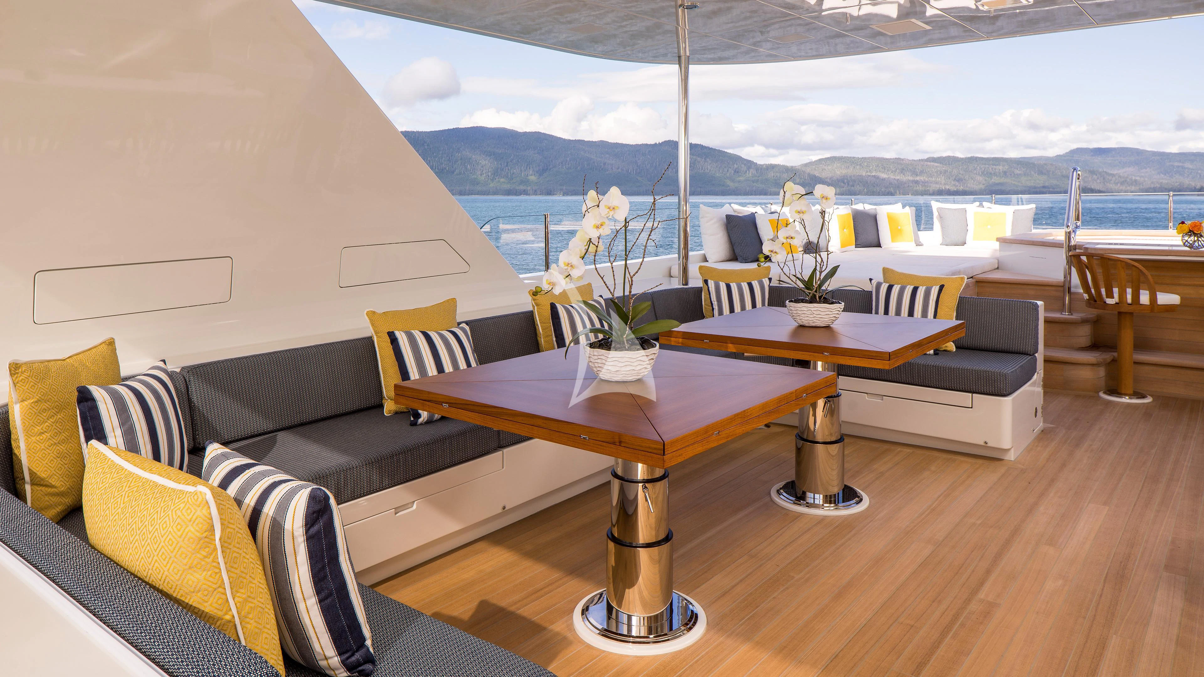 a room with a table and chairs aboard ENDLESS SUMMER Yacht for Sale