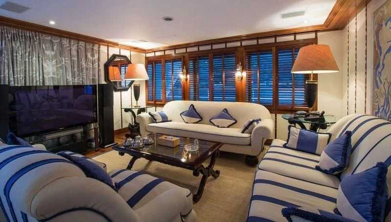 a living room with a couch and a coffee table aboard GRAND OCEAN Yacht for Sale