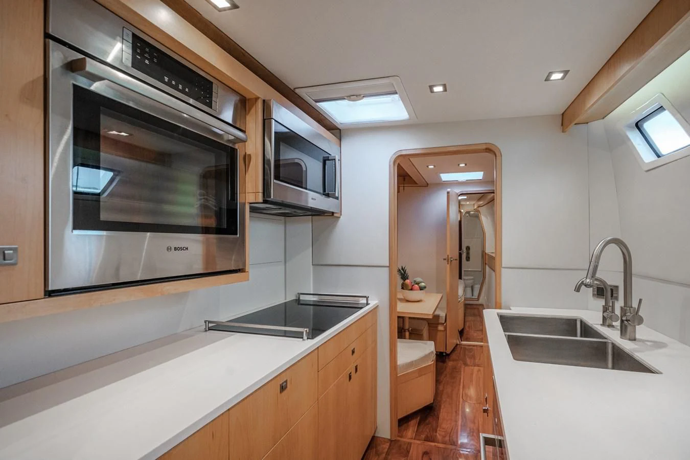 a kitchen with a sink and a microwave oven aboard MY CAT Yacht for Sale