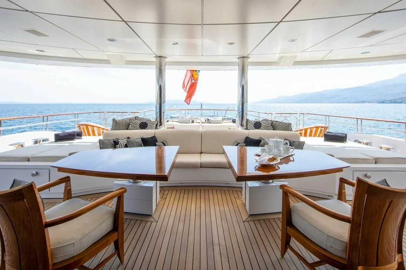 a room with a table and chairs aboard LUDZIE Yacht for Sale