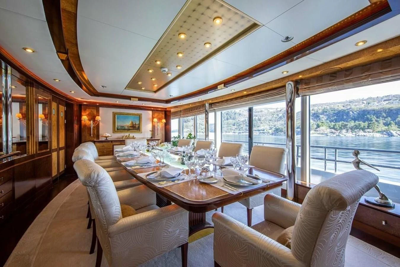 a dining room with a large window aboard LUDZIE Yacht for Sale