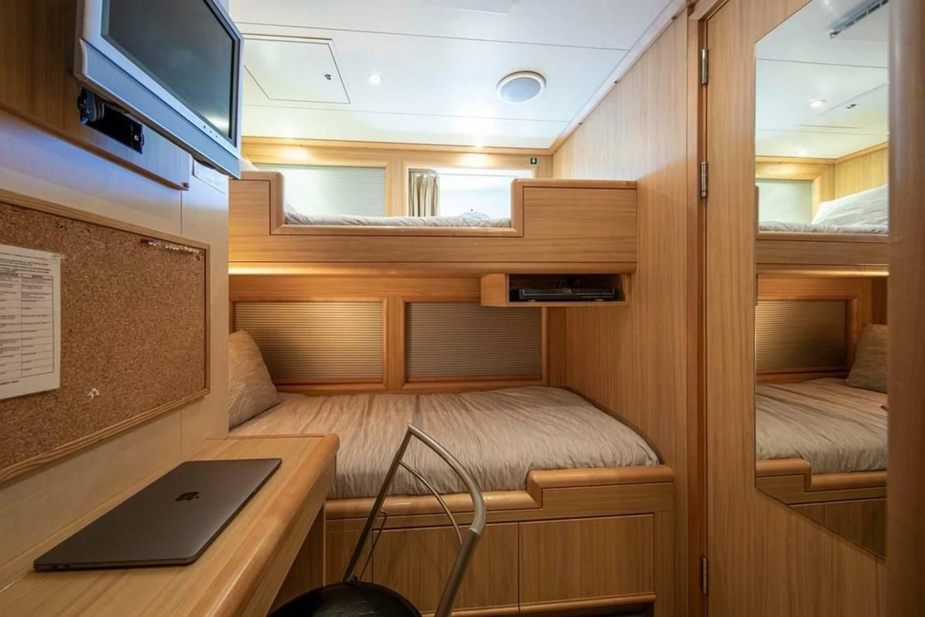 a room with a bed and a laptop aboard LUDZIE Yacht for Sale