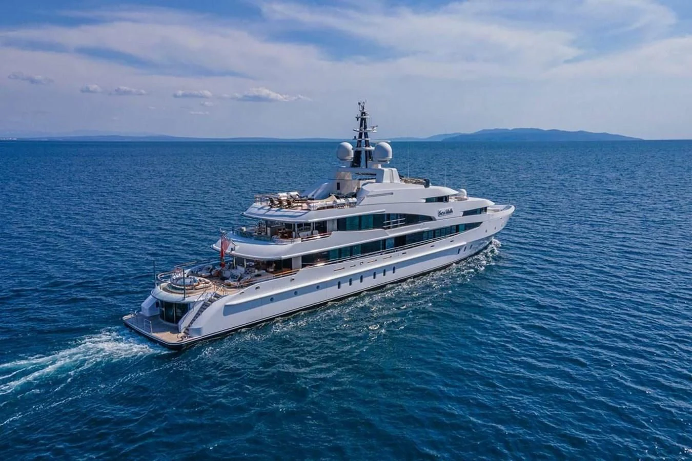 a large white boat in the water aboard LUDZIE Yacht for Sale