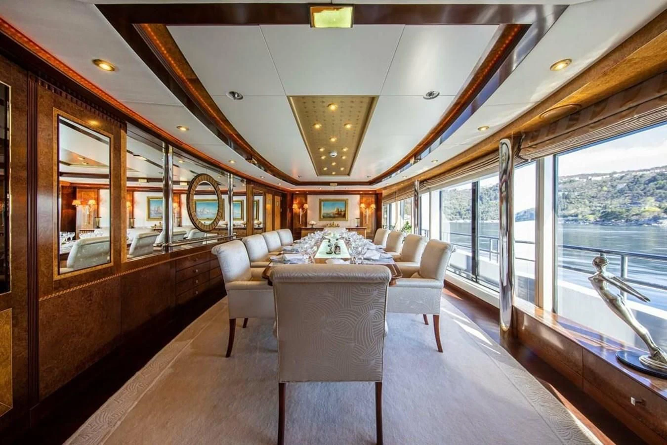 a large living room with a large window aboard LUDZIE Yacht for Sale