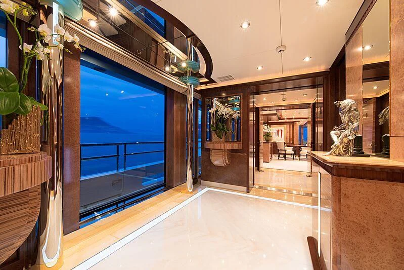 a room with a glass door and a statue in it aboard LUDZIE Yacht for Sale
