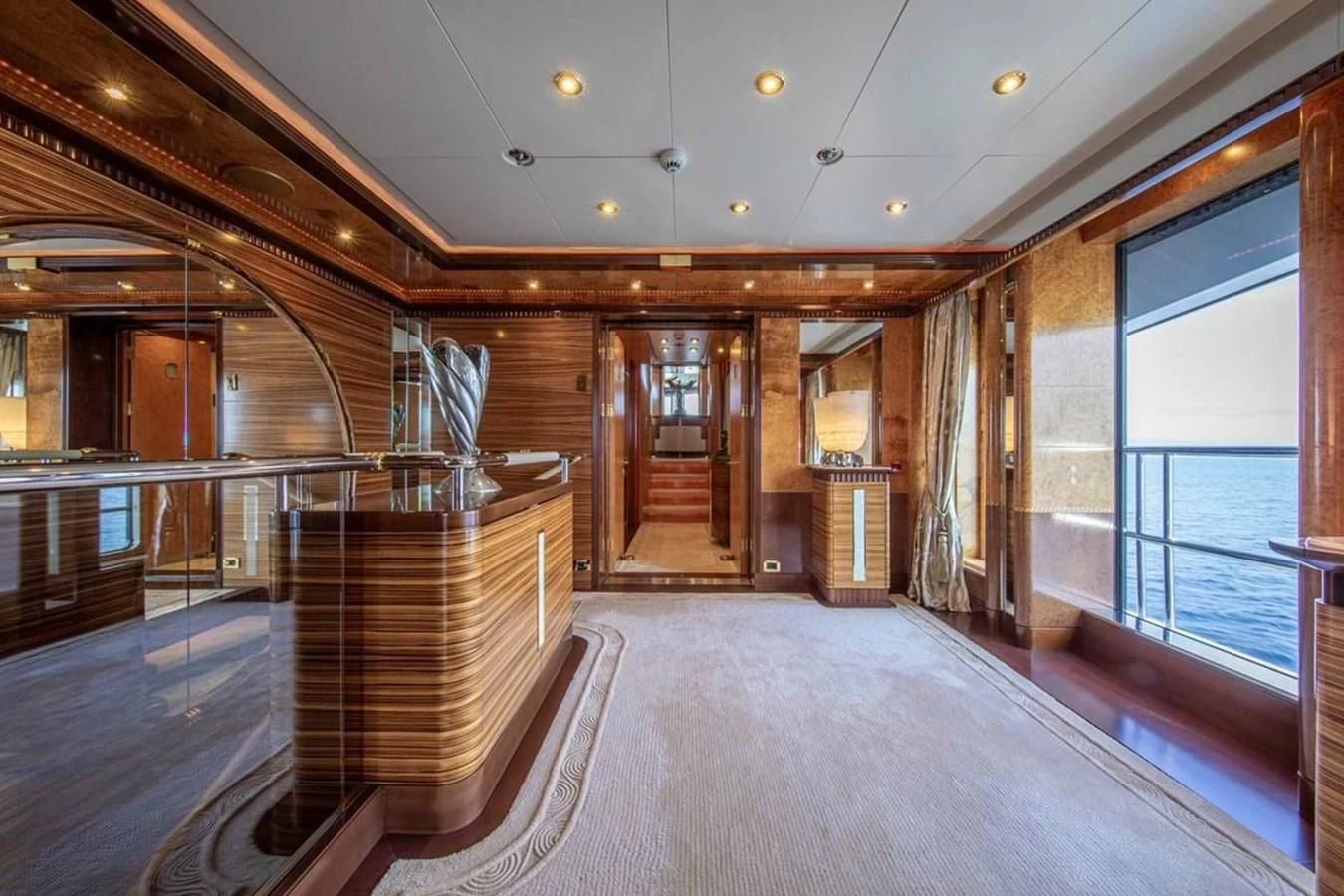 a large room with wood floors aboard LUDZIE Yacht for Sale