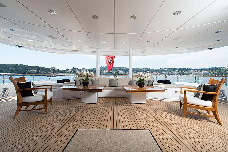 a room with a wood floor and a large window with a view of the city aboard LUDZIE Yacht for Sale